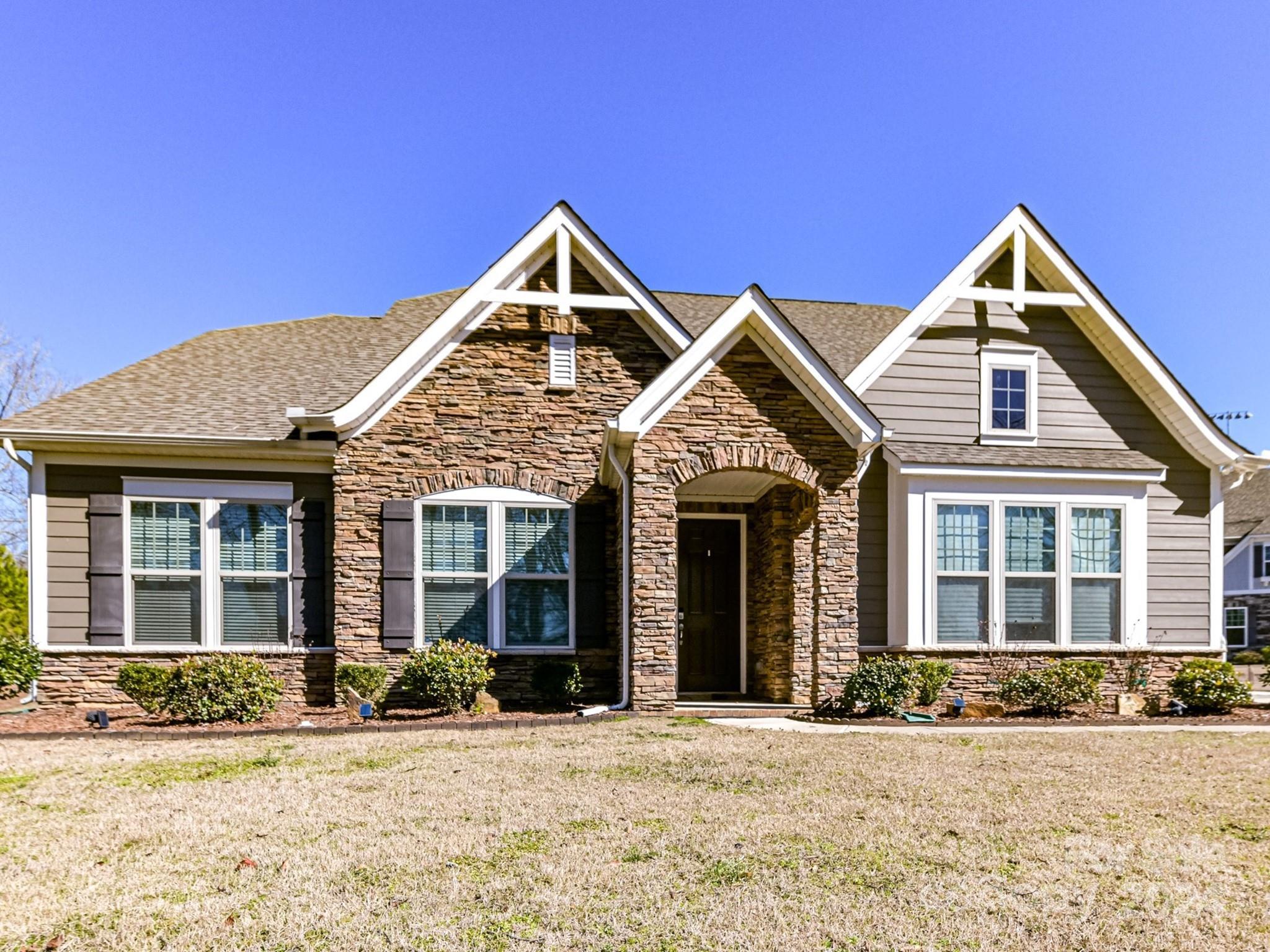Better than new, built in 2020.  Owners brokenhearted to leave this wonderfully placed home on one acre in the Lake Wylie area.  Upon entry you will be greeted by an expansive foyer and dedicated office space then the open light- filled dining, living, kitchen and breakfast areas all with 10 ft. ceilings.  The white kitchen includes a 5-burner gas cooktop, wall oven and microwave.  The 9ft. island offers granite counters and additional bar seating.  The split bedroom plan includes two main level bedrooms with a full bath and a gorgeous primary off the living room. The second floor offers an additional huge bedroom with an abundance of storage, a fabulous 5th bed/bonus room, full bath and walk-in attic storage. Enjoy the private fenced backyard with huge paver patio, screened porch, several fruit and ornamental trees along with raised garden beds.