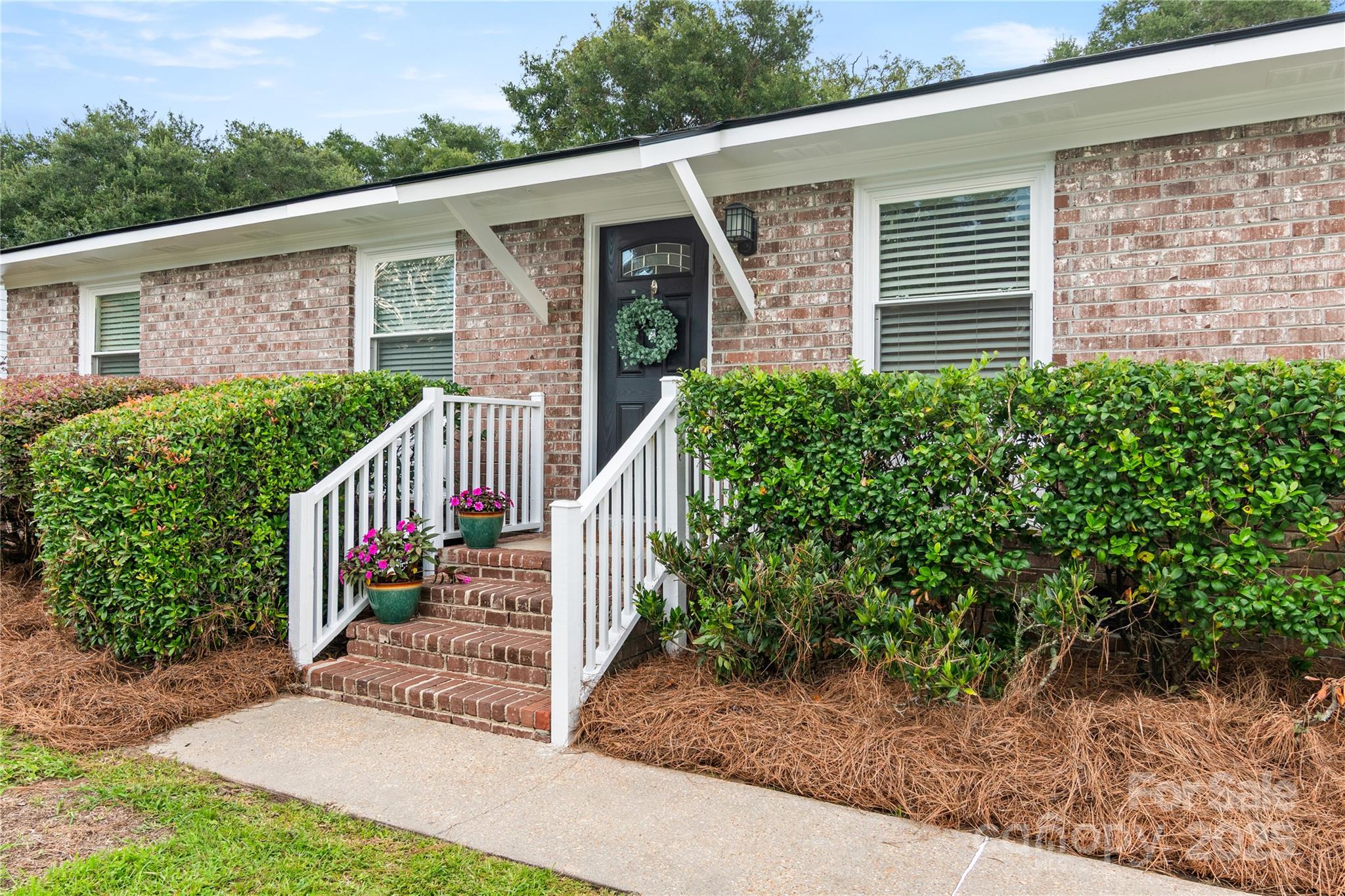 If you're looking for a James Island, SC home with charm & convenience, this brick ranch is worth a look. Set on a flat lot with a wooded backyard backing to Thomas Johnson Park & minutes from the James Island Connector, downtown Charleston & Folly Beach. Nearby find shopping, dining & James Island County Park. Inside, fresh paint, true tongue-and-groove hardwood floors & an open floor plan create an inviting space. The bonus room works perfectly as a home office, craft room or game room. You'll love the unique concrete countertops, upgraded half bath, new roof, newer HVAC, upgraded landscaping & privacy fence. Outdoors, enjoy Trex decking, outdoor fire pit & storage building. Enjoy your own backyard harvest, where mature citrus trees offer fresh, seasonal treats right at home. This well-maintained, move-in-ready home offers the perfect blend of location, updates & Lowcountry living!