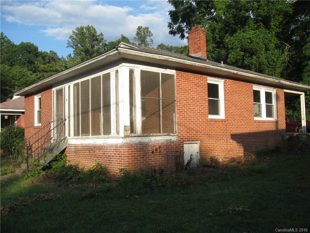 FIXXER UPPER WITH EXTRA ,BUILDABLE LOT.  Located in Swannanoa Valley, 10 min. to Black Mtn., Asheville and near-by Blue Ridge Parkway.  Solid Brick Home with City Water and Sewer.  3 BED 1 BATH with Mountain Views , Lots of potential!   Some updates, New windows 2001 and New Roof in 2007. Home comes with extra, buildable lot.  Buyer to confirm setbacks, availability of utilities. Two pin #'s. Extra lot (.15 Acre ) provides garden/ green space. Parking area in back of house where lot is located.