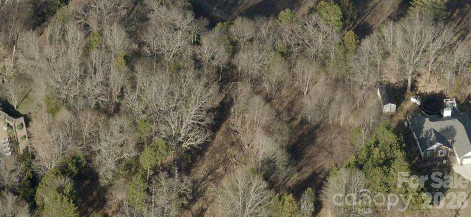 Nice building lot ready to go with lot cleared driveway in and building pad set.  Per the city water is available across the street and sewer through an easement.