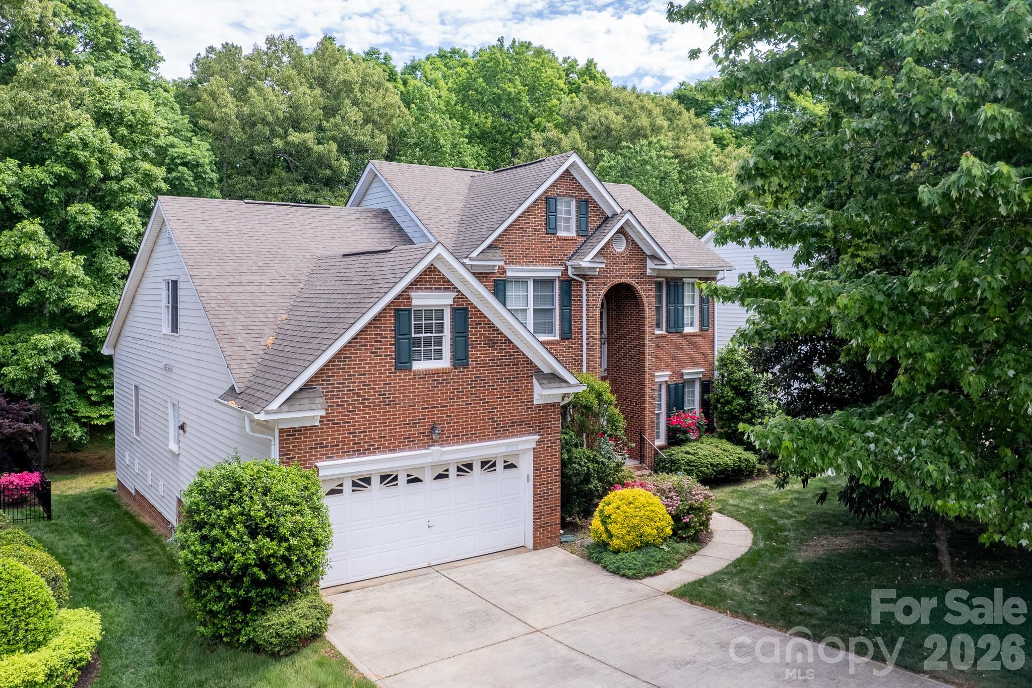 Immaculate, true 5-bedroom brick-front home in the heart of Ballantyne, featuring a highly sought-after main-level primary suite, a spacious 2-car garage, and a large, flat, private backyard backing to mature trees—offering the perfect setting for a future pool or outdoor retreat.

The main level welcomes you with a light-filled two-story foyer, elegant formal living and dining rooms with decorative molding, and a stunning two-story family room with a gas fireplace. Beautiful Brazilian hardwood floors add warmth and sophistication throughout the main living areas.

The updated white kitchen is both stylish and functional, complete with granite countertops, abundant cabinetry, and a spacious breakfast nook surrounded by windows. Enjoy seamless indoor-outdoor living with direct access to the deck—ideal for entertaining or relaxing.

Upstairs, you’ll find generously sized secondary bedrooms and a versatile bonus room or fifth bedroom, perfect for a media room, playroom, or guest suite, along with walk-in attic storage.

Beautifully landscaped with irrigation in both the front and backyard. Located in a prime South Charlotte location within top-rated school districts and just minutes from shopping, dining, and major highways.