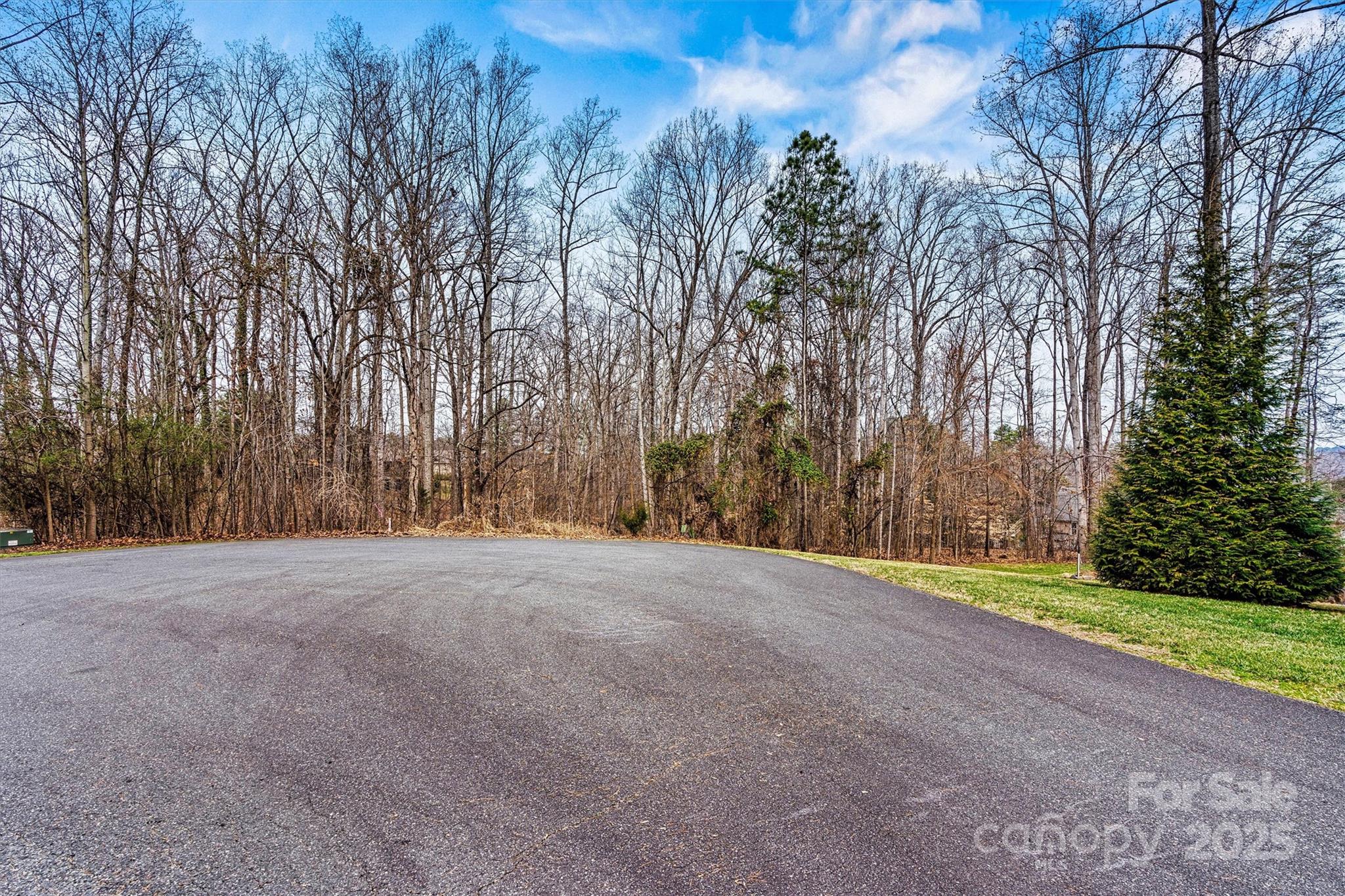This beautiful cul-de-sac lot in the highly desirable Grand Bay subdivision offers the perfect opportunity to build your dream home. With direct lake access and a private boat ramp, you can enjoy serene waterfront living. The community features a clubhouse, pool, and tennis courts, enhancing the lifestyle experience. Ideally located near  schools, shopping, and I-77, this property offers both convenience and tranquility. Bring your own builder and create the perfect home in this wonderful, well-established neighborhood.