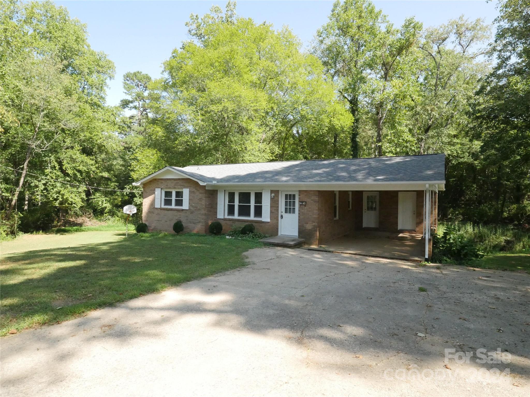 Private get-away in Viewmont, no neighbors in sight.  No HOA.  Bordered on 2 sides by small creeks but elevation certificate showing home is not in flood plain (see docs, part of lot is in flood plain).  New roof, new windows, new countertops, new appliances.  Refinished original hardwood flooring throughout - except kitchen & bath with new vinyl flooring.  Almost full basement with driveway accessible garage door.  Laundry room on main floor.  Located about 155'  from paved, city-maintained street.  No known road maintenance agreement.  Lot begins approximately 155' from pavement - see survey in docs.  GIS map is not accurate.  Although recently updated, this is not a flip house.  Owners have maintained this home as a long-term rental for several decades and simply decided it is too far away for them to continue to manage.  Adjacent lot is in the estate of owner's mother and will be for sale in the future.