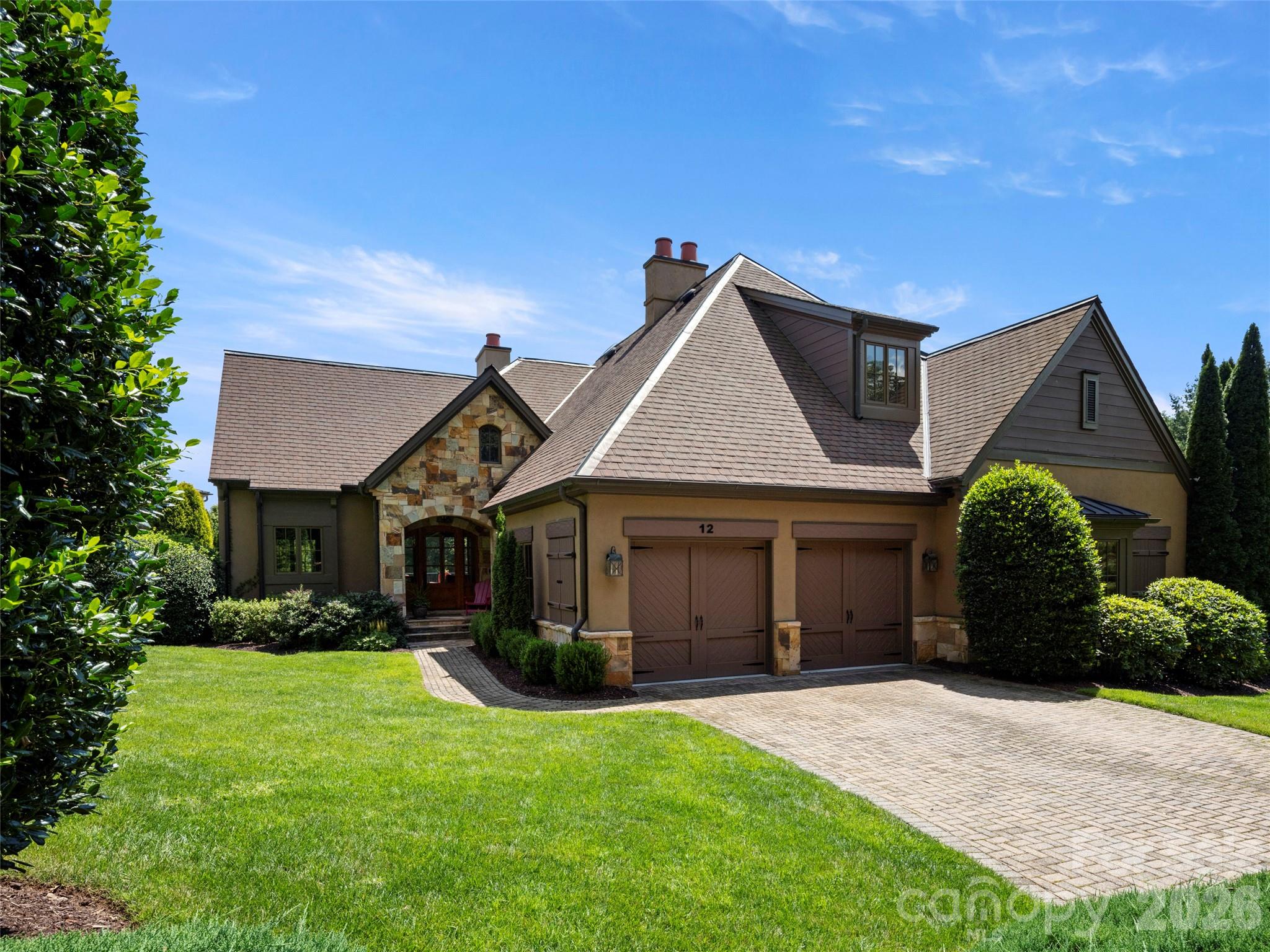 Perched within the prestigious Meadow Enclave of The Cliffs at Walnut Cove, this residence offers a masterclass in elevated, maintenance-free living. Designed for those who seek the perfect equilibrium between sophisticated entertaining and quiet mountain solitude, this home captures the quintessential spirit of the Blue Ridge Mountains.

The heart of the home is defined by an expansive open floor plan that transitions seamlessly from the gourmet kitchen to the light-filled Great Room. High ceilings and curated finishes create an atmosphere of airy elegance, anchored by a gracious primary suite that serves as a private wing of comfort. Panoramic vistas of the lush Jack Nicklaus Signature golf course framed by the rolling silhouettes of the Blue Ridge Mountains greet you while the tranquil, rhythmic melody of a private waterfall is situated just steps from your patio. Experience peace of mind knowing that the meticulously maintained grounds ensure that your time is spent enjoying the scenery, not tending to it.

The terrace level provides a dedicated sanctuary for family and guests alike. Featuring two comfortable guest suites and a generous family room, the layout offers a sense of scale that feels both impressive and intimate, the "perfect size" for modern luxury living. 

This is more than a home; it is a front-row seat to the natural beauty of Western North Carolina, wrapped in the exclusive amenities of one of the region’s most coveted private communities where one membership opens a world of activities and friendships across the seven Cliffs communities in NC and SC!