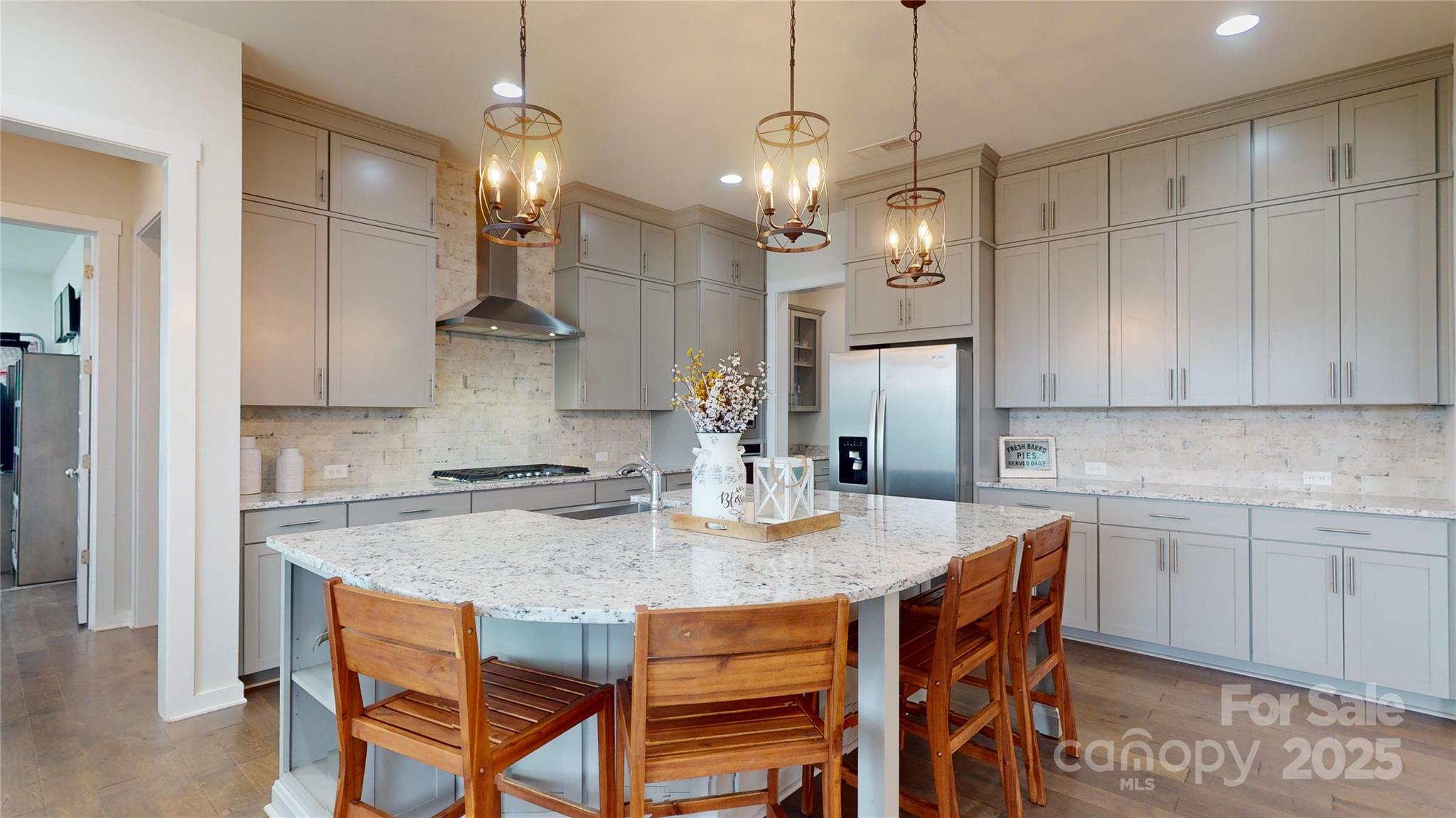 Seller offering $15k concession w/ acceptable offer. Can be used for closing costs, permanent or temporary rate buy down-buyer decides! Welcome home where you can live, play & explore in the highly sought after Paddlers Cove neighborhood in Lake Wylie/Clover SC. This exquisite Hopewell floorplan built by Fielding Homes in 2020 is where luxury meets craftsmanship. The grand foyer greets you home to a 5 bed (guest suite on main), 4 full bath, flex/bonus room, planning center & 2 car + tandem garage. Entertain away in your gourmet kitchen, stacked cabinets, gas cooktop, wall oven, stainless farmhouse sink & furniture island w/ storage. Cozy up to your living room linear fireplace or open the double doors to the covered patio w/ stone fireplace & fenced back yard. Primary en suite is an oasis w/ oversized closet, dual vanities, gorgeous counters, & rainfall shower w/ extended bench. Amenity rich neighborhood-pools, playground, trails. Highly rated Clover Schools- zoned for Crowders Creek*.