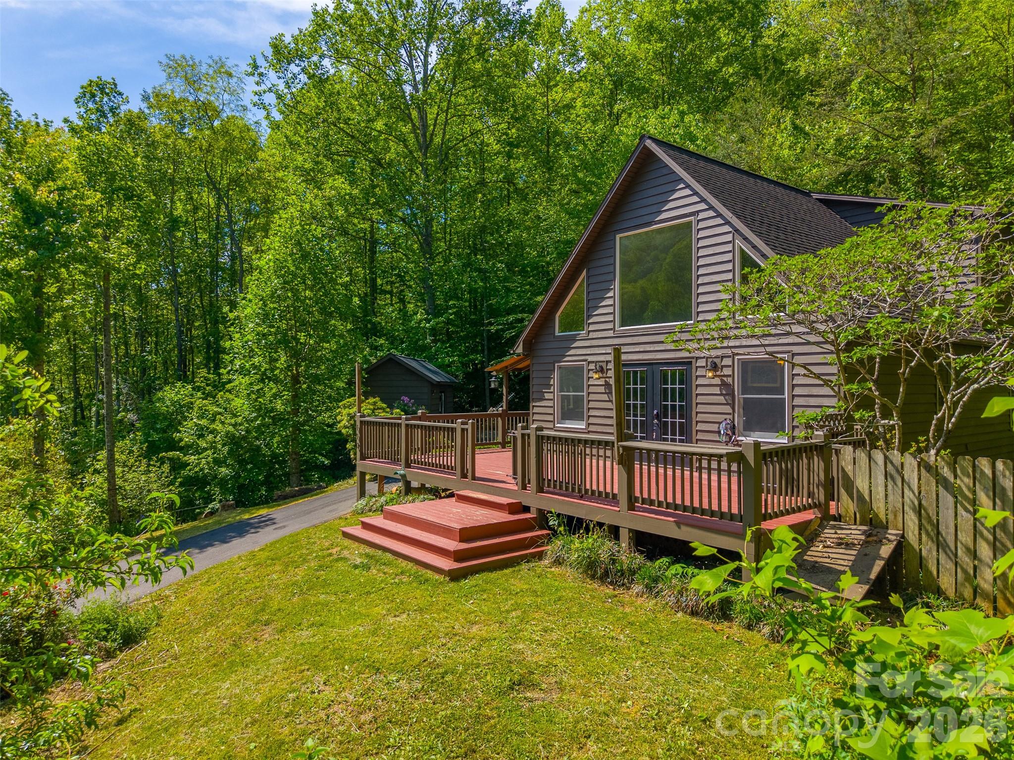 Tucked away in the heart of the mountains, 110 Wyoming Drive offers the perfect blend of charm, character, and modern comfort. This 3-bedroom, 2 bath home features inviting A-frame vibes with stylish updates throughout, creating a warm and unique living space.
Step outside and enjoy your own private retreat with a small creek at the bottom of the property, an ideal spot to create a peaceful sitting area and unwind. The property also offers a great space for a small garden, beautifully maintained landscaping, and an outdoor shed perfect for hobbies or additional storage.
Conveniently located just minutes from Dillsboro and Sylva, you get the best of both worlds, quiet mountain living with easy access to local shops, dining, and amenities. Whether you are looking for a full-time residence, vacation home, or investment opportunity, this property is full of potential and mountain charm.