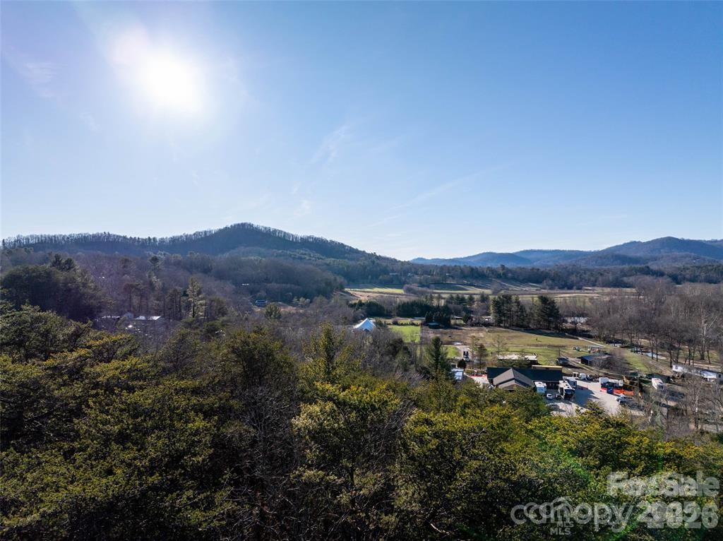 Prime 6+ Acre Parcel in Swannanoa – Minutes to Asheville & Black Mountain
Bring your dream home to life on this desirable 6+ acre parcel in the heart of Swannanoa. With sweeping long-range mountain views and buildable terrain, this property offers the perfect blend of natural beauty, privacy, and convenience.  Tucked away for a secluded feel yet just minutes from both Asheville and Black Mountain, this land presents a rare opportunity to create a private estate or mountain retreat. City water is nearby (buyer to confirm availability and connection options), and potential septic sites add flexibility for development. Currently part of a 17-lot subdivision plat, the property offers ample space and versatility to accommodate your vision—whether that’s a custom home, multi-generational homestead, or peaceful getaway.