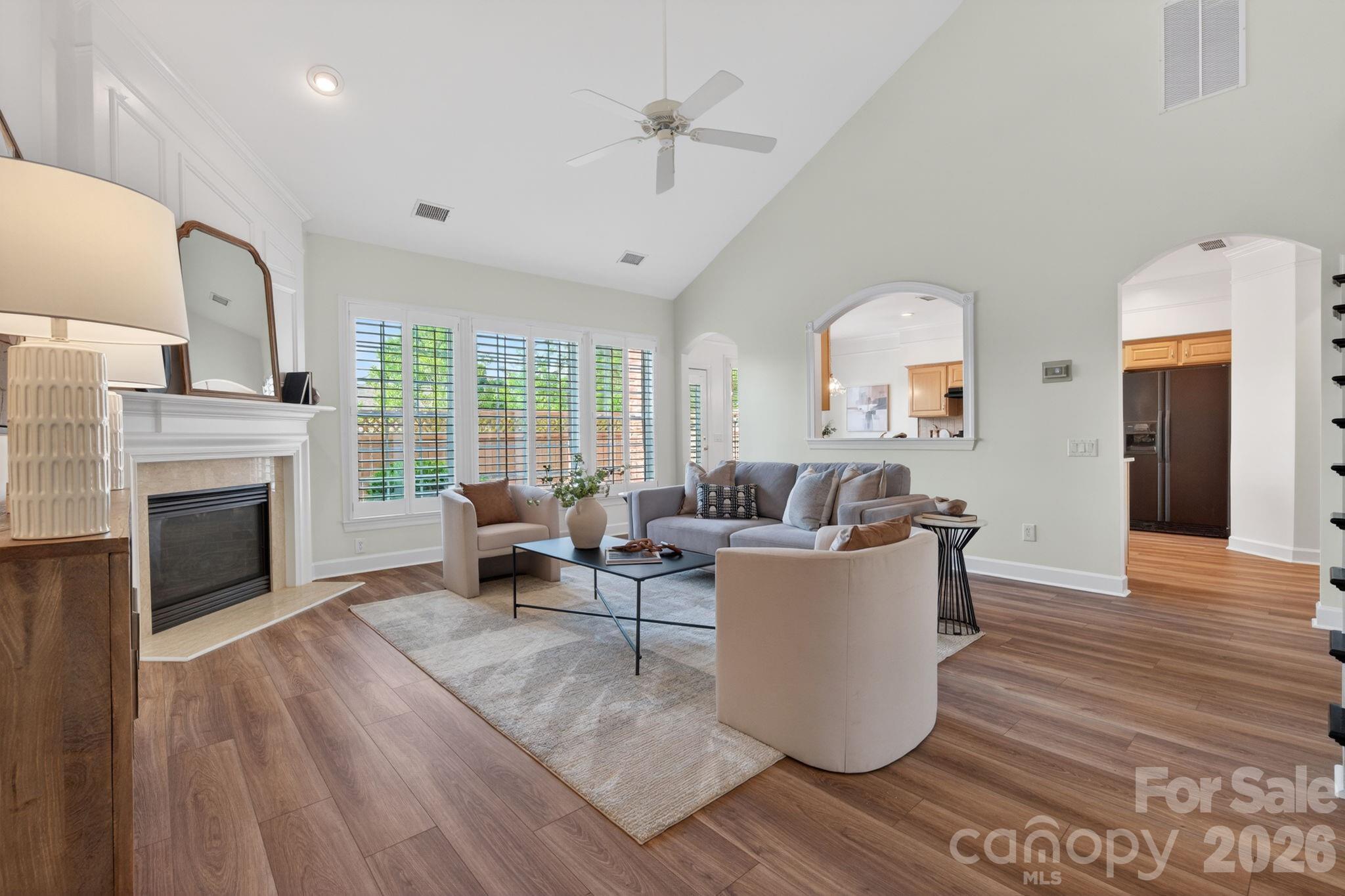 *** BOM with new flooring throughout the main level ***  Experience refined living in the heart of Ballantyne with this stunning full-brick, end-unit home, ideally located just moments from Ballantyne Village, The Bowl, Corporate Park, and The Quad. This townhomes extra-wide footprint gives you the feel of a single family home and offers the perfect balance of style with convenience.

Step inside to an inviting open-concept layout highlighted by soaring ceilings, abundant natural light and a warm gas fireplace that anchors the spacious Great Room—ideal for entertaining or quiet evenings at home. Freshly painted throughout, providing a neutral palette that feels bright, updated, and truly move-in ready. The main-level Primary Suite provides a serene retreat, complete with a tray ceiling, spa-inspired bath featuring a soaking tub, walk-in shower, and generous walk-in closet.

The well-appointed Kitchen showcases granite countertops, tile backsplash, stainless steel appliances, pantry storage, and a bright breakfast area overlooking the expansive private patio. The Dining Room features classic architectural details.

Upstairs, you’ll find two spacious bedrooms, a versatile loft perfect for a home office, media space, or fitness area, plus ample walk-in attic storage.

Enjoy outdoor living on your private patio—perfect for grilling or relaxing on Carolina evenings. This end unit enjoys expansive side green space adding to it's privacy. With walkability to premier dining, shopping, greenways, and community amenities, this exceptional home offers the lifestyle today’s buyers are seeking.