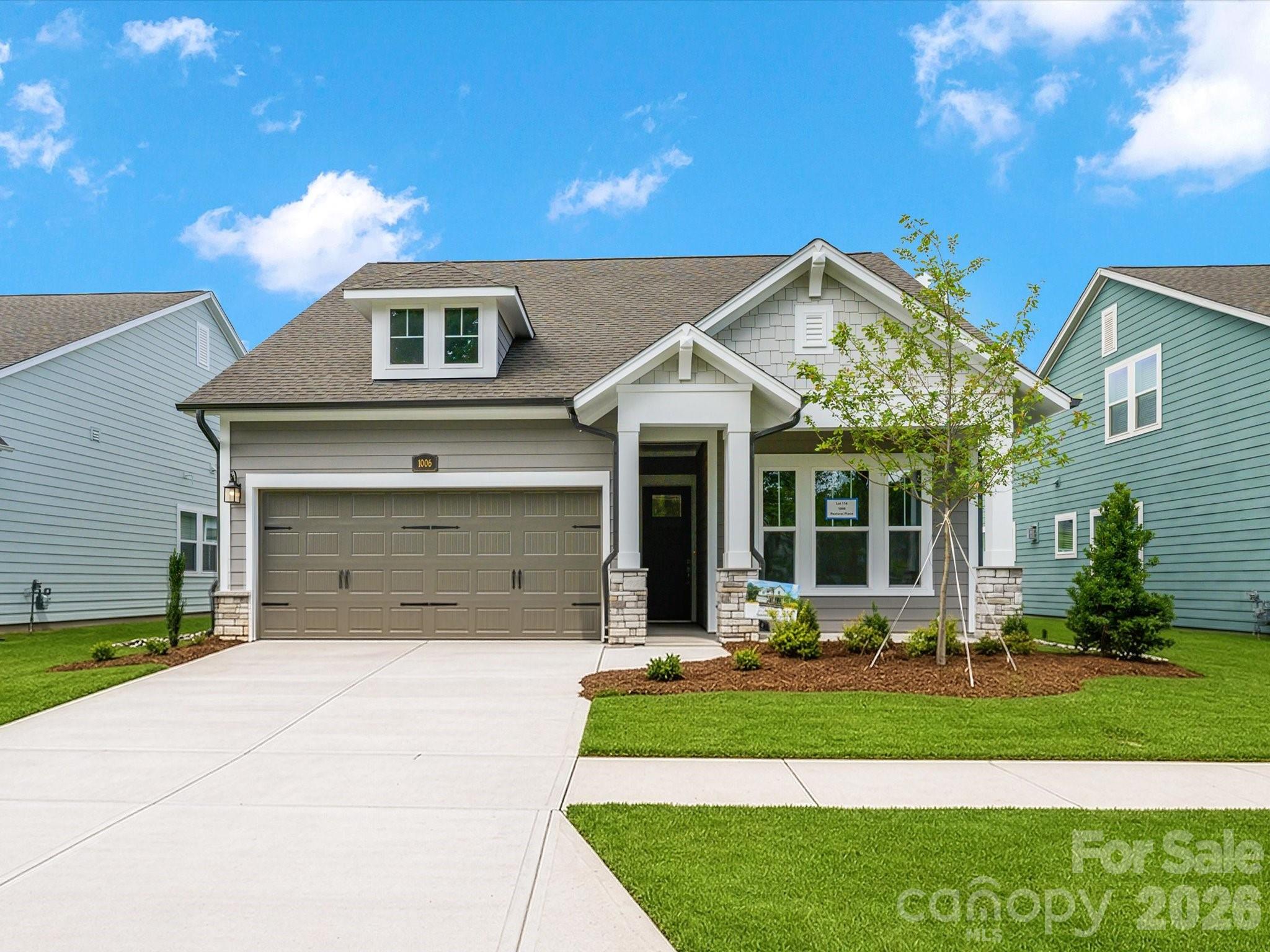 From the classic charm of a rocking chair front porch to the comfort of a covered rear porch, this new ranch-style home offers everything you’re looking for in Waxhaw, NC.   The open-concept layout is ideal for both everyday living and special celebrations. The spacious kitchen island is the perfect gathering spot for sharing meals, treats, and memories with family and friends. The family room with a fireplace provides a beautiful backdrop to showcase your personal style and create a warm, welcoming atmosphere.  Your Owner’s Retreat is a private sanctuary, complete with a luxury en suite bathroom and a deluxe walk-in closet, offering a blissful beginning and end to each day. Your luxurious, zero-entry, walk-in shower showcases elegant tile to the ceiling.  A secondary bedroom adds flexibility and functionality—ideal for guests, a TV lounge, or hobby room.  The study with a closet and French doors is stylishly elevated with judges paneling.  This home is complete with solid-surface flooring throughout, no carpet.  Built with comfort and efficiency in mind, this home comes with an Environments For Living® certification, guaranteeing energy usage for the first three years.