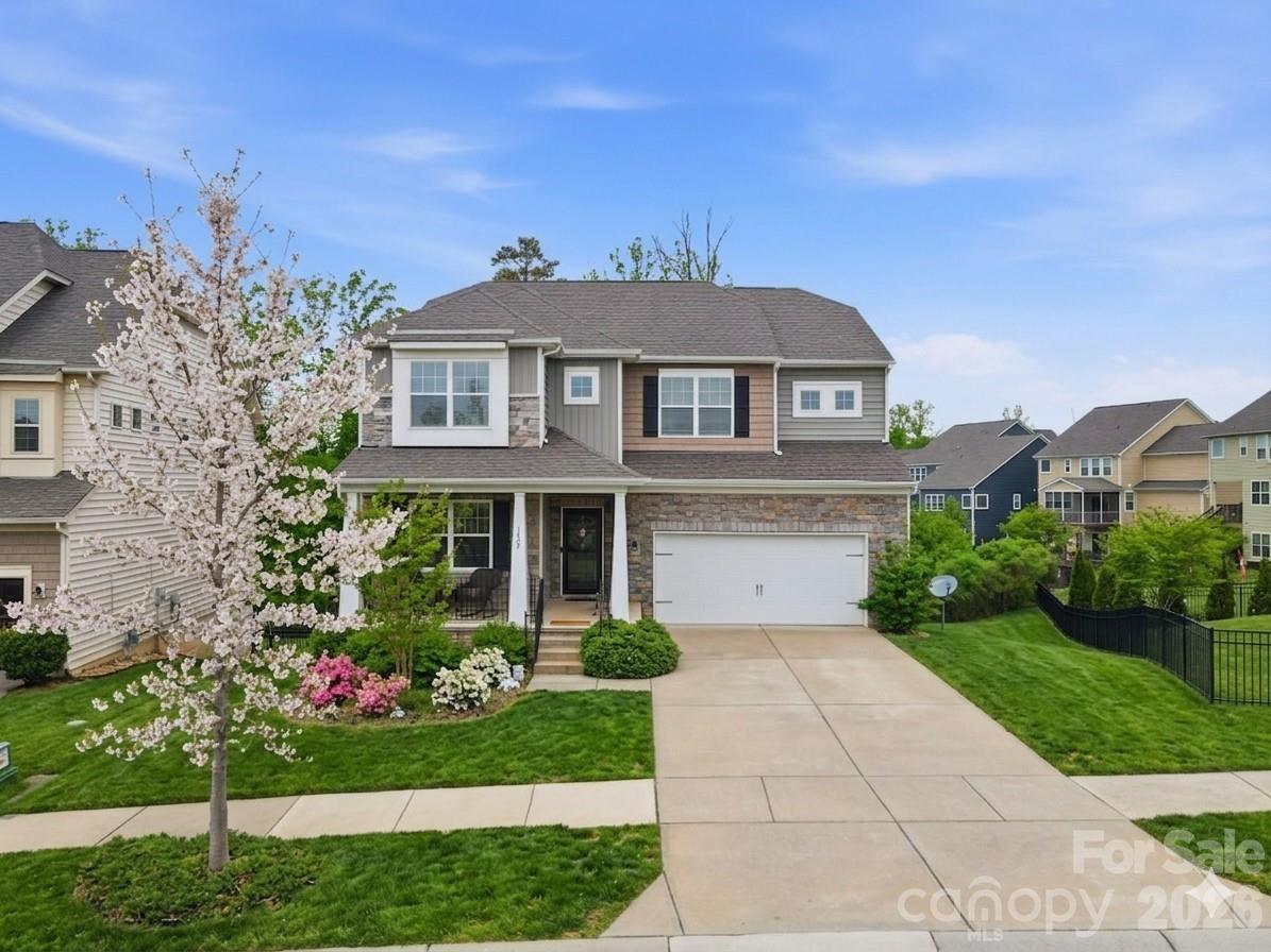 NEW PRICE!! Incredible opportunity to own the lowest price per square foot in the highly sought after Waterside at the Catawba community. This expansive three story home offers exceptional flexibility, space, and value. Perfect for today’s modern lifestyle.

From the moment you step inside, you’re welcomed by an open, light-filled main level designed for both everyday living and effortless entertaining. The oversized kitchen anchors the home with abundant cabinetry, generous counter space, and seamless flow into the living and dining areas. A dedicated office with French doors provides the ideal work from home setup, while the large back deck invites you to unwind and enjoy peaceful, tree lined views, your own private retreat.

Upstairs, you’ll find four generously sized bedrooms plus a versatile bonus space currently used as a theater room, easily converted into a fifth bedroom, playroom, or second home office to fit your needs.

The fully finished basement adds approximately 1,300 square feet and creates a true second living quarters, complete with a second laundry room. Perfect for guests, multigenerational living, a home gym, recreation space, or private suite. This level dramatically expands both the functionality and long term value of the home. 

Outside, you'll find an extended patio, stone-surround grill and beautiful sounds of nature. 

Waterside at the Catawba is known for its vibrant and social atmosphere, featuring a clubhouse, tennis courts, pickleball, and community amenities that encourage connection and active living. Conveniently located directly across from Catawba Ridge High School and just minutes from shopping, dining, and everyday conveniences, this home blends comfort, community, and convenience in one exceptional offering.

Homes of this size, flexibility, and value rarely come available in this neighborhood. All that's needed is you to make your own memories and experience luxury living at 1404 Bryson Gap.