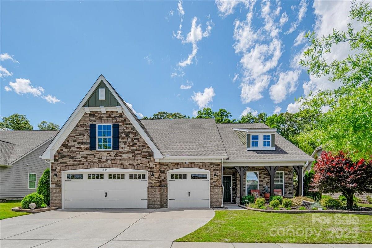 Beautifully upgraded home on a private, tree-lined lot in the sought-after Tree Tops community! A true focal point is the 22'x12' climate-controlled sunroom—perfect for year-round enjoyment with peaceful views of the wooded backyard. The exterior was freshly painted in May 2025 and is complemented by custom landscaping, a paver patio, and a dedicated grill pad. Inside, you'll find Mohawk laminate floors, new tile in the full baths, and 4" plantation shutters throughout. The gourmet kitchen features custom drawers and pullouts, a new fridge (2024), and an island with seating and prep space. The spacious owner’s suite offers a luxurious walk-in shower, and the garage includes convenient overhead storage. Enjoy resort-style amenities: clubhouse, fitness center, pool, tennis, pickleball, bocce, dog park, lake, trails, amphitheater, and the Village Cabins with arts, crafts, and more. Truly move-in ready!
