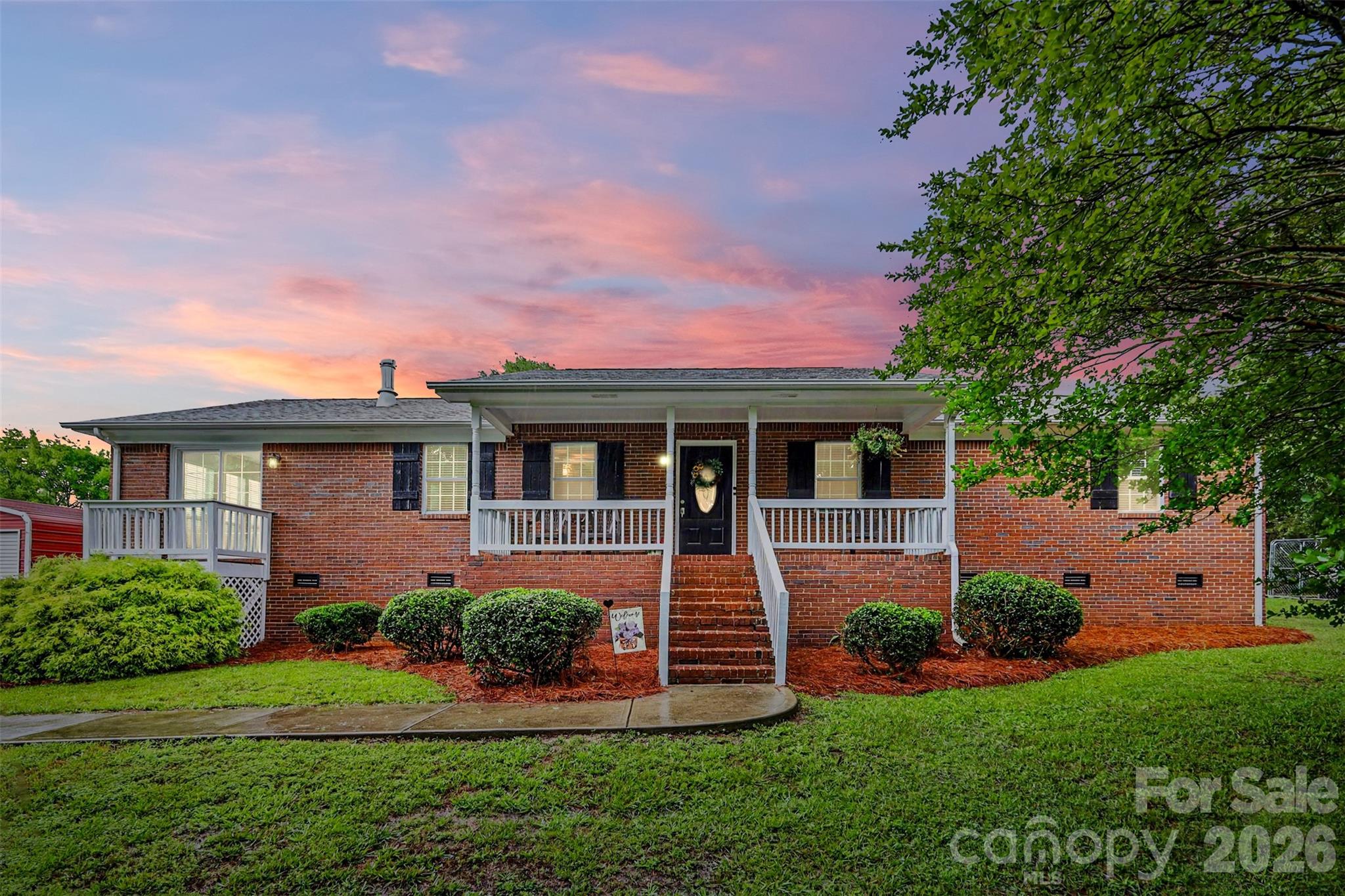 Beautifully updated full brick ranch situated on 2.17 acres in peaceful Wingate! This 3-bedroom, 2-bath home offers 1,798 sq ft with an inviting open floor plan perfect for everyday living and entertaining. Features include LVP flooring throughout the main living areas, carpet in the bedrooms, and a spacious primary suite with private ensuite bath. The versatile laundry/mudroom can also serve as a home office or flex space. Enjoy the outdoors with plenty of open space, fenced pasture area, large rear deck, and welcoming covered front porch. Detached 2-car garage provides additional storage and workspace. Refrigerator, garage freezer, washer, and dryer all convey. Located in a USDA financing eligible area offering potential zero down financing opportunities for qualified buyers.