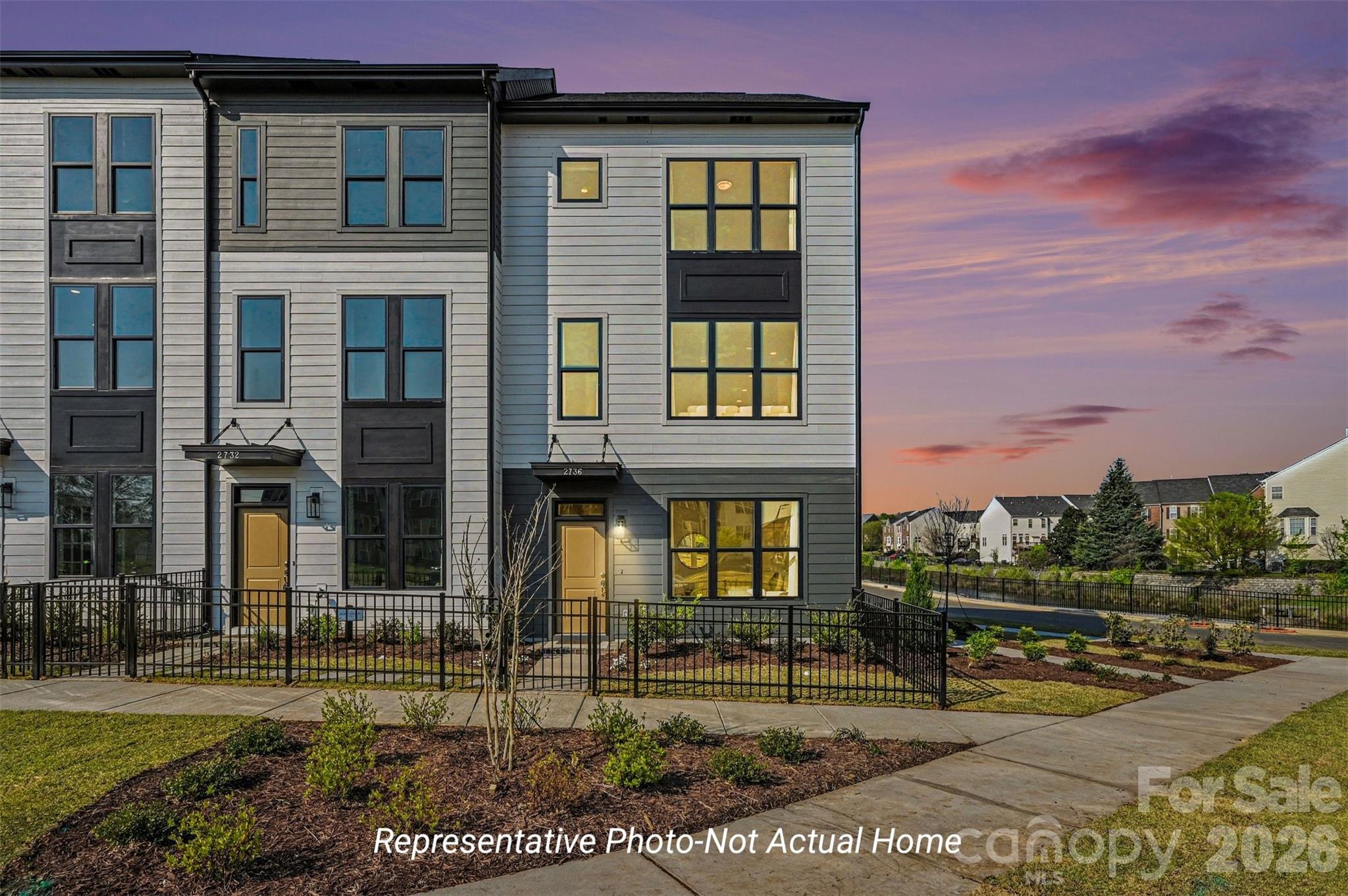 Welcome to the ultimate in flexible, three-level living! The Charlestown is engineered to perfectly match today’s fast-paced lifestyle, mixing premium finishes with a highly functional layout.

The Ground Floor: Drive right into your massive, private 2-car garage! This level also features a welcoming entry foyer and a fully secluded guest suite with a full bath—an ideal setup for visitors, roommates, or a quiet work-from-home haven.

The Main Level Showstopper: This floor is an entertainer's dream. A large, open-concept living room flows effortlessly into a true designer kitchen, anchored by an oversized central island and a rare, walk-in pantry. The spacious dining area opens directly out to the balcony, making indoor-outdoor entertaining a breeze.

The Top-Floor Oasis: Head upstairs to unwind. The luxurious owner’s suite boasts a private bath with a double vanity, a sleek walk-in shower, and a massive walk-in closet. Just down the hall, a secondary bedroom and its own full bath ensure total comfort and privacy for family or guests.