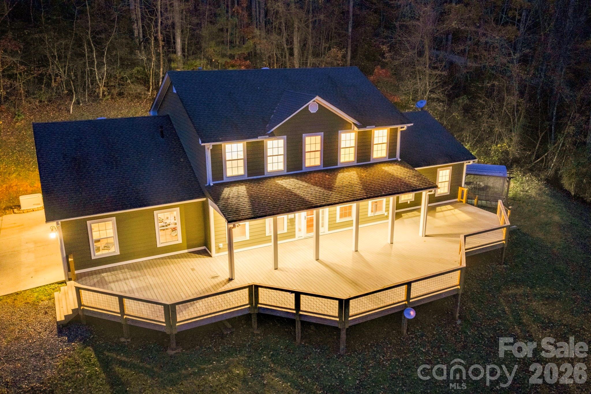 DRASTIC REDUCTION! $70K below recent appraisal! This traditional home offers main-floor living with room to spread out, inside and out. The spacious primary suite features an en-suite bath with two walk-in showers and two walk-in closets. A large living room with a stone gas-log fireplace opens off the eat-in kitchen, alongside a study with pocket doors for privacy and a formal dining room. Upstairs you'll find two bedrooms plus a large, flexible bonus room with a full bath — ideal as a playroom, gym, or office, and easily convertible to two rooms. Outdoors, an 1,100 sq ft Trex deck spacious enough to double as a dance floor anchors a private backyard with a firepit, gazebo, and plenty of room to garden. Additional features: low-maintenance Hardie siding, 3 car attached garage, new interior paint throughout, tankless water heater, intercom system, whole-house Generac generator, and a private 10 GPM well. All this accompanied by a private setting and just 10–15 minutes to Sylva and WCU.