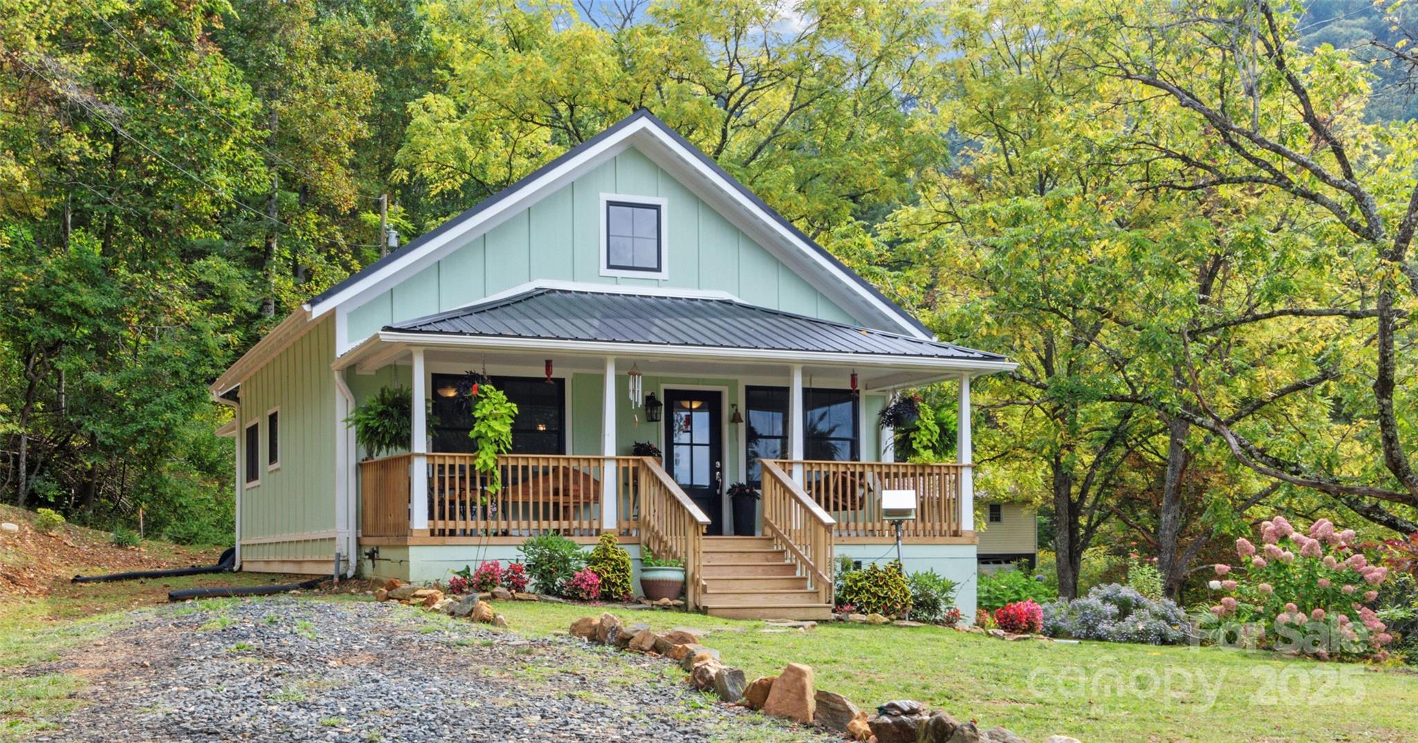 Beautifully restored and complete renovation!  This home has been updated inside and out, with gorgeous new kitchen and baths.  2 Bedroom and 2 full baths, new HVAC with gas backup.  Beautiful 16+ acres located in Bakersville at 3000+ elevation.   Huge barn sits in gently sloping field, and the balance of the acreage is wooded including several small creeks and springs. Beautiful building spots.  Only one neighbor passed this house on Terrell Dr, very private and borders land protected by the Appalachian Conservancy. This home had no damage from Hurricane Helene.  This is the perfect mini farm or private get away! Come and see this home today.
