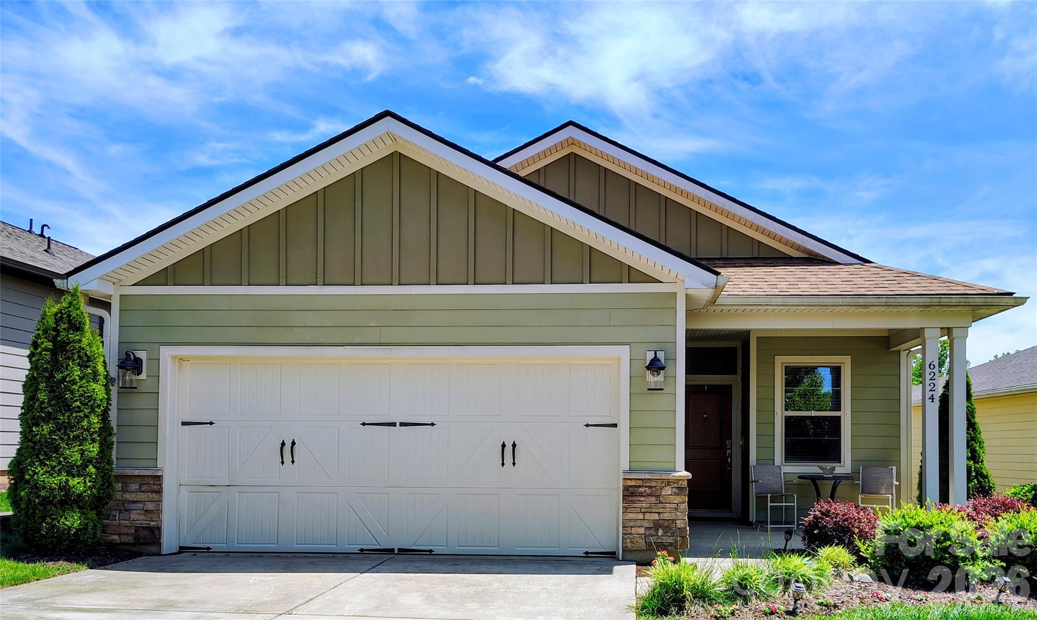 Welcome home to this lovely 2-bed, 2-bath residence in the resort-style 55+ community of Trilogy. This inviting home offers an expansive living area accented by a dramatic wall of windows that open to your private, covered rear patio—an ideal space for both relaxing and entertaining. Both the front and rear views are among the best in the neighborhood, giving this home a truly special setting.

The spacious kitchen features an oversized island that serves as the perfect gathering spot for friends and family. A separate dining room and a versatile flex room provide additional space for work, hobbies, or hosting.

The large primary suite offers a peaceful retreat with its ensuite bath and generous walk-in closet. 

Trilogy’s exceptional amenities elevate everyday living: enjoy a zero-entry resort pool, indoor lap pool, state-of-the-art fitness center, wine room, billiards room, pickleball courts, scenic walking trails and so much more. The Freedom Boat Club allows members free access to a fleet of boats on Lake Norman. The Foundry Restaurant at Twin Mills Club offers delicious menu options and a full bar—dine indoors or out on the patio. With a full calendar of daily activities, you’ll love the vibrant, social lifestyle this community provides.