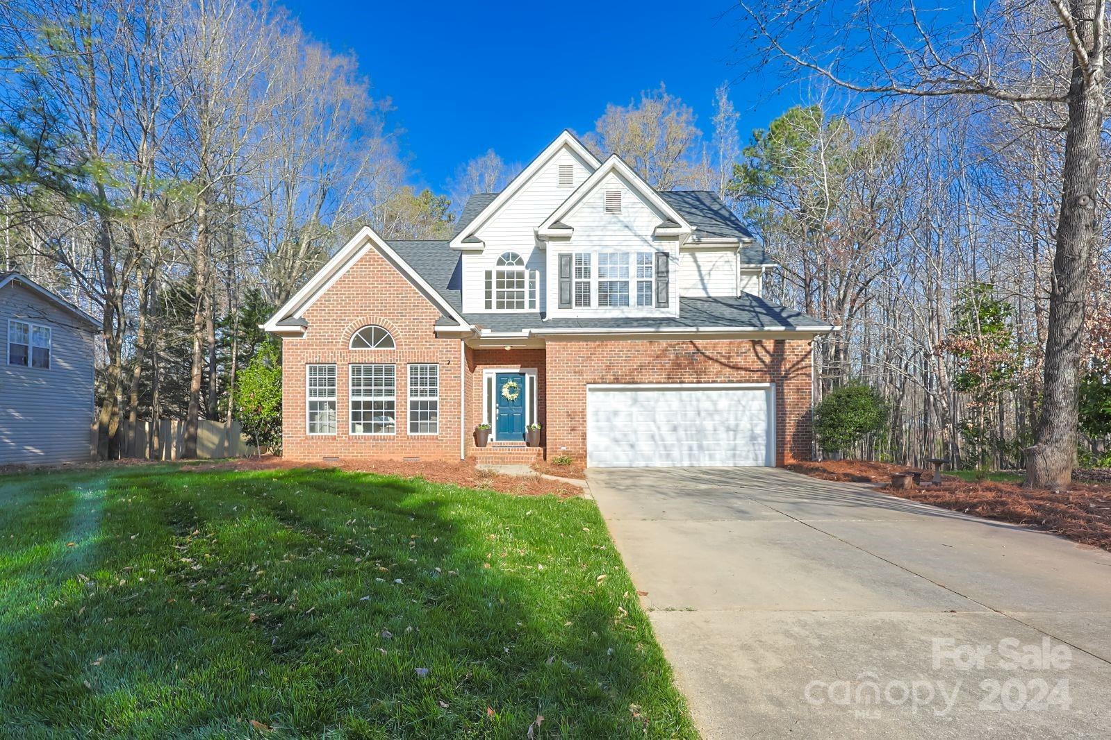 You will feel like you have walked into a Pottery Barn catalog. This home is tastefully decorated and neat as a pin! you can move right in and not change a thing. So much natural light with expansive windows and a large yard with plenty of shade from the towering canopy of trees surrounding. You can enjoy your morning coffee on the deck overlooking the woods or sit in your family room with vaulted ceilings, decorative brick way and fireplace. Open floorplan with the dining, kitchen and family room all flowing for perfect entertaining for intimate dinner parties or hosting larger gatherings. The main level primary suite offers privacy and has it's own bath with large walk-in closet, dual vanity and separate shower and tub. Upstairs there are two bedrooms with generous closets and a third bedroom/bonus that is a great flex area for office, playroom or home gym. So many neat features and new lighting added to this home make it cozy and trendy. Welcome home.