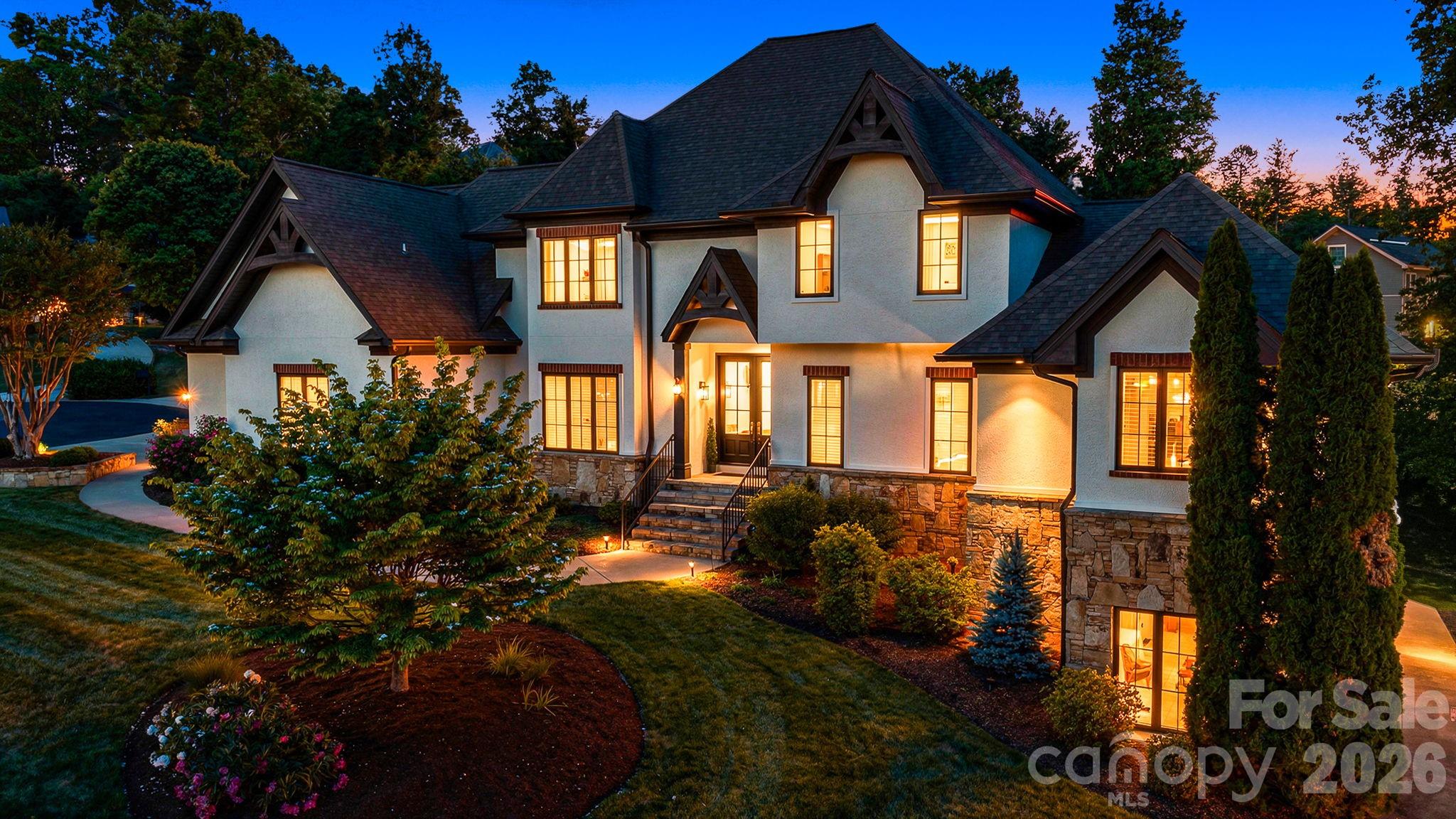 Settled in the highly desirable Sterling neighborhood, this exceptional home offers flexible living spaces designed to fit every lifestyle. Dramatic floor-to-ceiling windows fill the semi-open floor plan with natural light, seamlessly connecting the formal dining area to the expansive eat-in kitchen. Thoughtfully designed for both entertaining and everyday living, the kitchen features radiant heated tile floors, abundant cabinetry, an oversized prep island, double ovens, and a wine fridge.

The spacious main-level primary suite serves as a private retreat with two walk-in closets, an oversized dual-head shower, and a separate soaking tub. Upstairs, you’ll find three additional bedrooms, two full baths, and a soundproof room perfect for podcasting, radio production, music recording, or a quiet creative workspace.
The lower level provides incredible versatility with space ideal for a game room, home office, fitness area, and an additional full bath. An unfinished section offers the perfect opportunity for a workshop, storage, or future expansion.

Step outside to an outdoor living space designed for entertaining, with plenty of room to gather, relax, and enjoy. Ample parking is another standout feature, including a 2-car garage and two separate driveways for added convenience.
