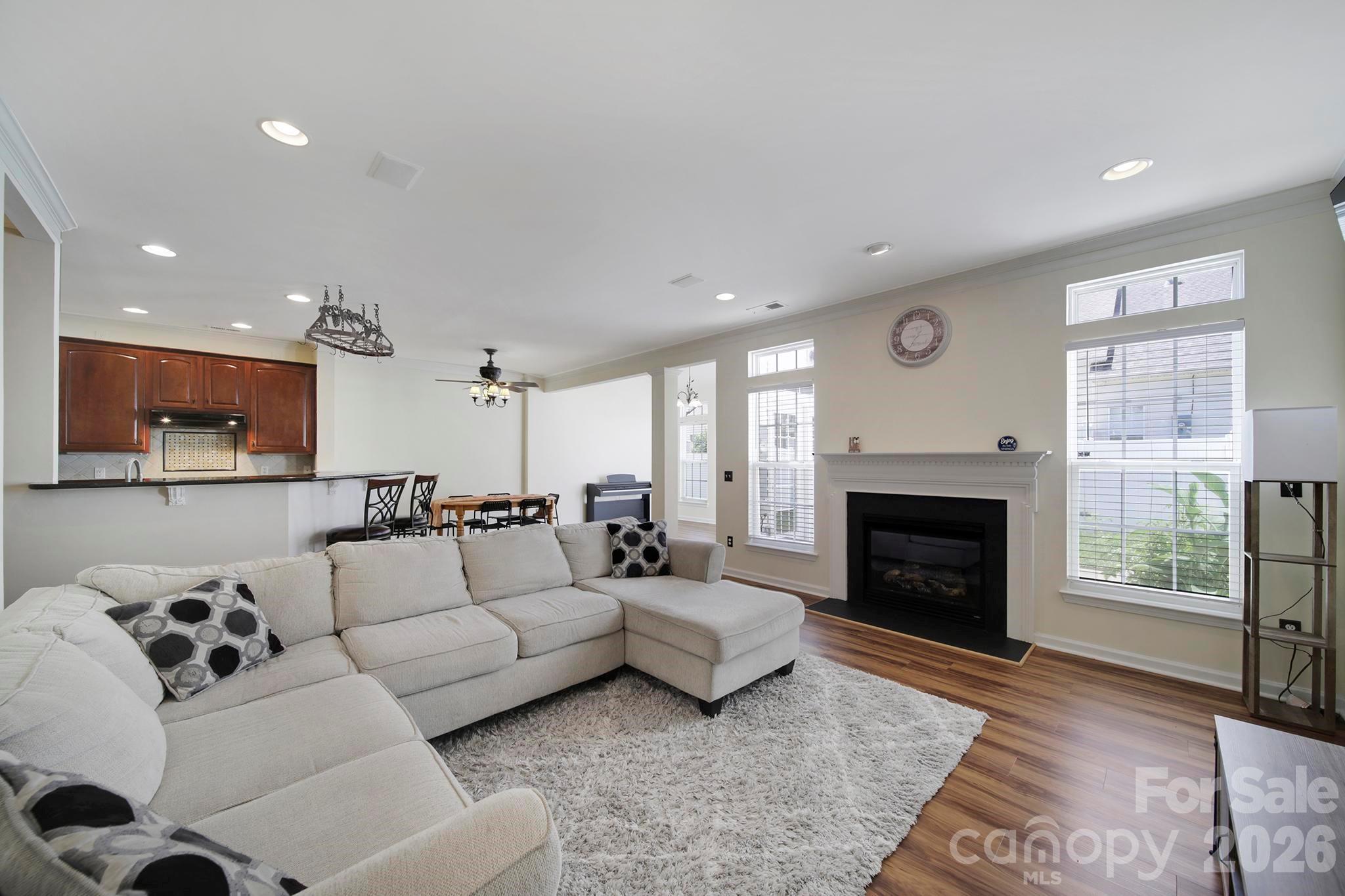 Welcome to this beautifully updated townhome located in the highly sought-after and award-winning Clover School District! Nestled in the desirable Lake Wylie area, this stunning home offers the perfect combination of comfort, style, and convenience. Step inside to an inviting open floor plan filled with abundant natural light, featuring a spacious great room with a cozy fireplace and surround sound pre-wiring, a formal dining room, breakfast area, and a bright sunroom ideal for relaxing or entertaining.

The beautifully appointed kitchen features granite countertops, a stylish tile backsplash, and ample space for cooking and gathering. Fresh interior paint and luxury vinyl plank flooring throughout the main level create a modern, move-in ready feel, while brand-new carpet upstairs adds warmth and comfort.

Retreat to the spacious primary suite featuring elegant tray ceilings, dual walk-in closets, and a spa-inspired bath complete with a whirlpool tub, separate shower, and double vanity. Thoughtful upgrades and details throughout enhance the home's charm and functionality.

Outdoor living is equally impressive with a rare oversized fenced backyard offering privacy, mature landscaping, and two patio spaces perfect for entertaining or enjoying quiet evenings outdoors. Community amenities include a pool and playground, all conveniently located near Charlotte, Rock Hill, Gastonia, shopping, dining, and everything Lake Wylie has to offer. This home truly checks all the boxes! Professional pictures COMING SOON!