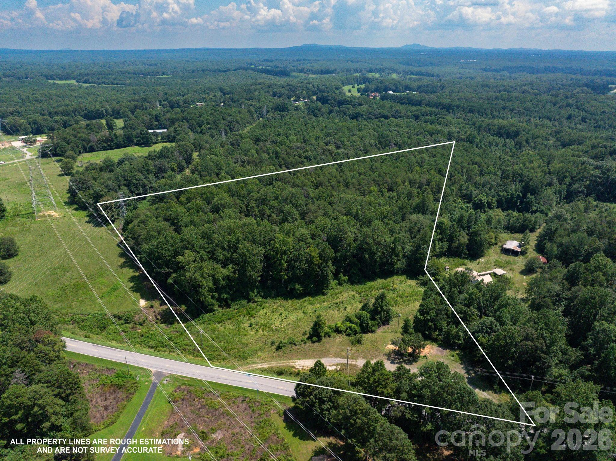 MOTIVATED SELLER!! This beautiful 10.76 acres is waiting for someone to create their perfect canvas. If you are looking to build your dream home, homesteading, or a little privacy all while not being too far away from shopping and grocery stores, this has all of the above. There is a creek on property and the majority of the land is cleared with a tree line boundary. Per seller, there is a 4 person septic on the property where a mobile home used to be. New water line and meter will have to be installed. Located just minutes from the new 74 Bypass!