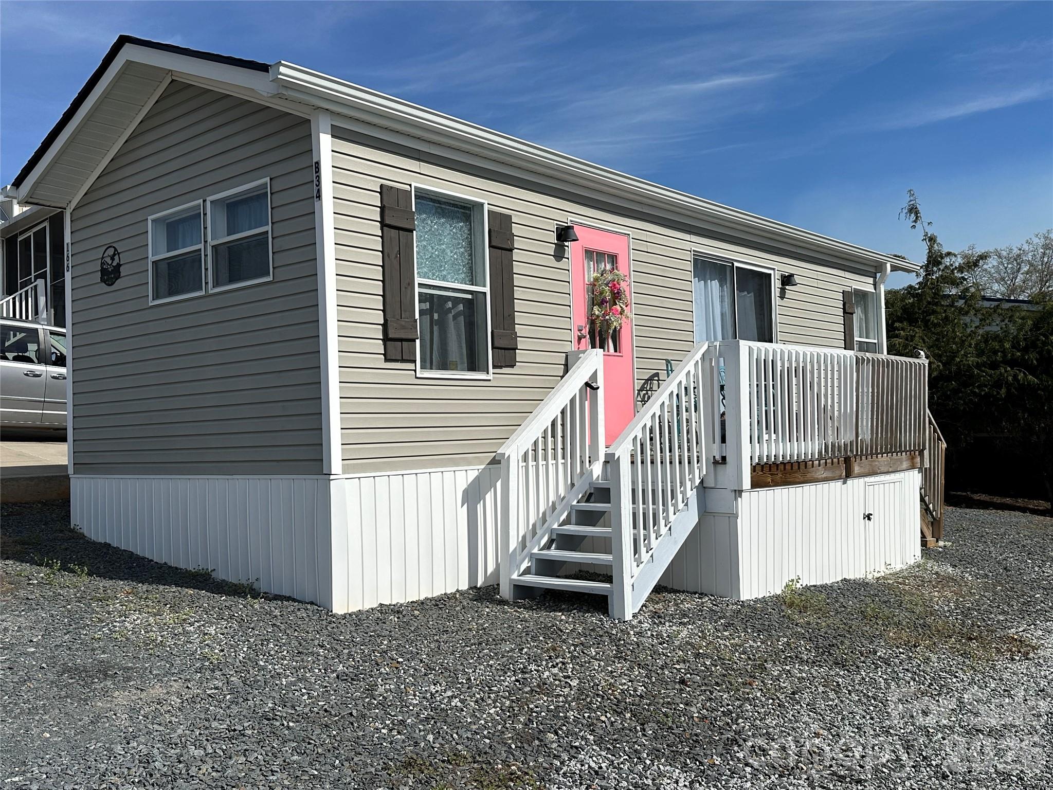 Move-in ready one-bedroom park model home located in the desirable Badin Shores Resort! This well-maintained property features numerous recent updates, including a new roof, gutters, vinyl skirting, and fresh interior paint (2024), along with a new water heater and HVAC system with a protective duct shield box (2026). Skylights enhance the home with abundant natural light, complementing the high ceilings and creating a bright, open atmosphere throughout. The open-concept layout seamlessly connects the kitchen, living, and dining areas—perfect for entertaining or enjoying quiet evenings at home. Whether you're searching for a full-time residence or a relaxing vacation retreat, this home offers both comfort and convenience. Enjoy all that resort living has to offer, including a swimming pool, putt-putt course, basketball/pickleball courts, fishing pier, sandy beach, playgrounds, and a vibrant community with an active events committee hosting activities year-round.