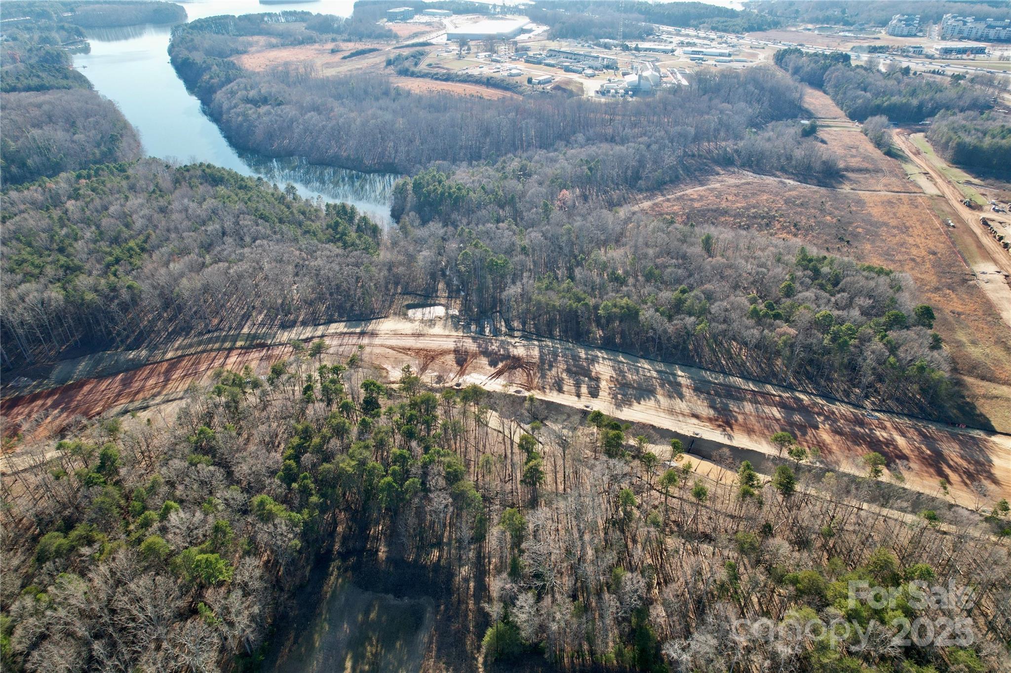 Prime Development Opportunity on 7.92 acres off of Langtree Road, Mooresville, NC. This property is zoned Corridor Mixed-Use (CM), offering immense flexibility for a range of uses, including multifamily housing, retail, and office developments. Situated directly across from Lowe’s Home Improvement’s corporate headquarters, a sprawling 275-acre campus developed to house up to 10,000 employees, providing a built-in market for future development. Adjacent to the upcoming East-West Connector Road, currently under development, which will further enhance accessibility and traffic flow in the area. Completion date Q3 2026 Easily accessible to I-77 at Exit 31