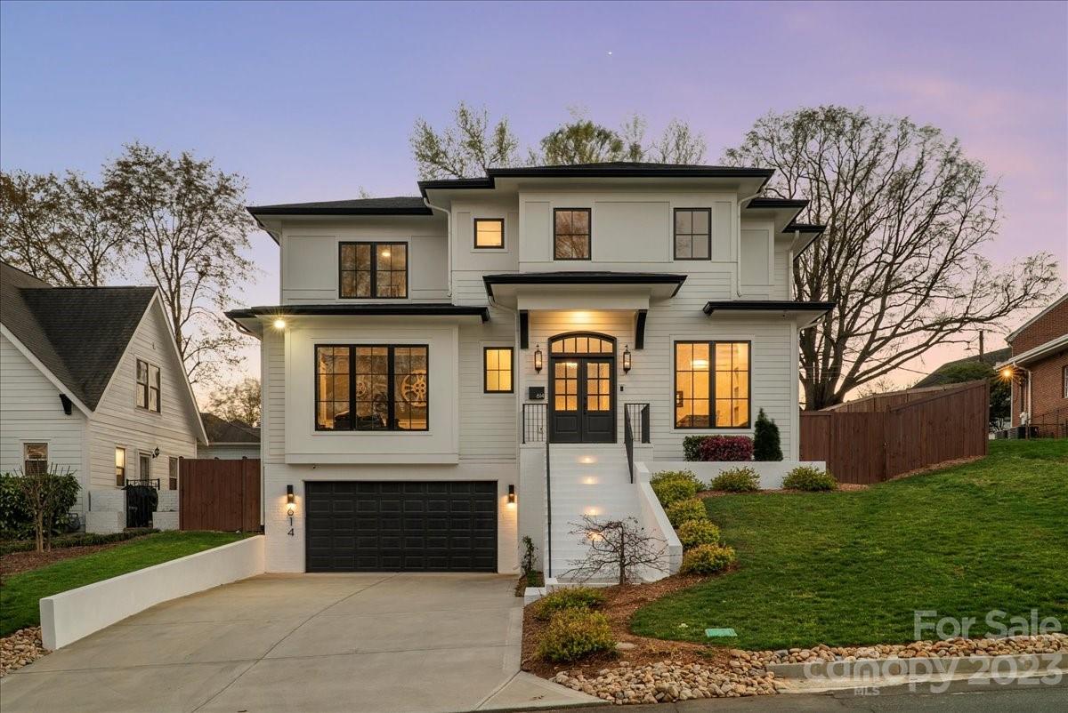Welcome to Magnolia House! A rare gem nestled in the heart of Dilworth. Every detail of this home was meticulously designed to create a modern and open layout without losing warmth and charm. You will be wowed the moment you step in the door. White oak hardwoods span throughout the home, but your eyes will be drawn to the true showpiece of this home: a floor-to-ceiling glass, temperature-controlled wine vault housing over 500 bottles. An upstairs primary suite that is truly jaw-dropping with a sleek, 60-inch fireplace, but the true jaw-dropper is watching your 75-inch television drop down from the ceiling. Your lavish primary bath is sure to give you a spa-like experience. A floor-to-ceiling tile shower featuring 6 shower heads, 4 of which are rain head style that function fully automated by UbyMoen. The bottom level of this home houses what can function as a guest suite, in-home chef suite, or in-home nanny suite.  Furniture Negotiable.