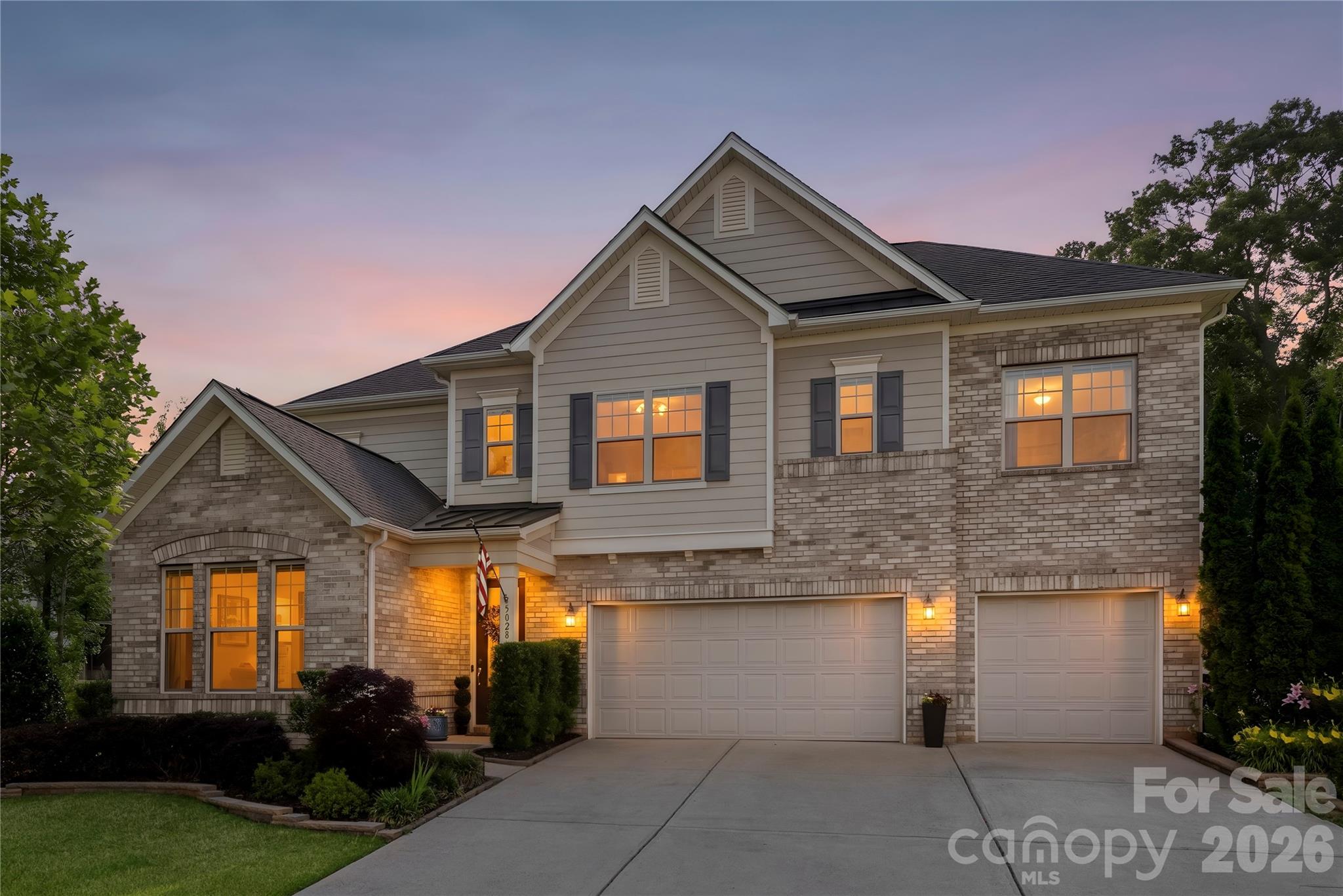 Experience resort-style living every day in this stunning private retreat tucked away on a half-acre cul-de-sac lot with over 4,000 square feet of beautifully updated living space. Ideally located near Waxhaw, a rapidly growing Charlotte suburb known for blending rich 18th-century history with modern upscale living and a highly walkable historic downtown, and close to Indian Land, one of the region’s fastest-growing areas offering convenient shopping, dining, and commuter access.

This five-bedroom, four-bath home offers the perfect combination of luxury, comfort, and thoughtful design. From the moment you walk in, the open floor plan, beautiful engineered wood floors, fresh neutral paint throughout the whole home, and clear sightlines through the great room to the backyard create an impressive first impression. The layout flows seamlessly with spacious living areas designed for both everyday comfort and entertaining.

The backyard is truly one of a kind, featuring a terrace, wood burning custom Patio Fireplace, built-in grill, private putting green, professionally landscaped grounds, and exceptional privacy that makes home feel like a private retreat. Inside, the sellers have invested extensively in thoughtful upgrades throughout the home, including quartz countertops and backsplash in the kitchen, a quartz built-in desk area, new wood and engineered flooring upstairs throughout the loft and bedrooms, designer lighting in multiple rooms, matte black kitchen fixtures, a new stainless steel kitchen sink, and custom built-ins with lighting surrounding the fireplace. Additional features include designer blinds throughout, a custom drop zone with a built-in study area, and beautifully updated finishes at every turn.

Conveniently located near community amenities including a pool and nearby gym access, this home stands out for its premium condition, spacious design, and exceptional outdoor living experience. This is a rare opportunity to own a truly turnkey property with custom details, privacy, and luxury features throughout.