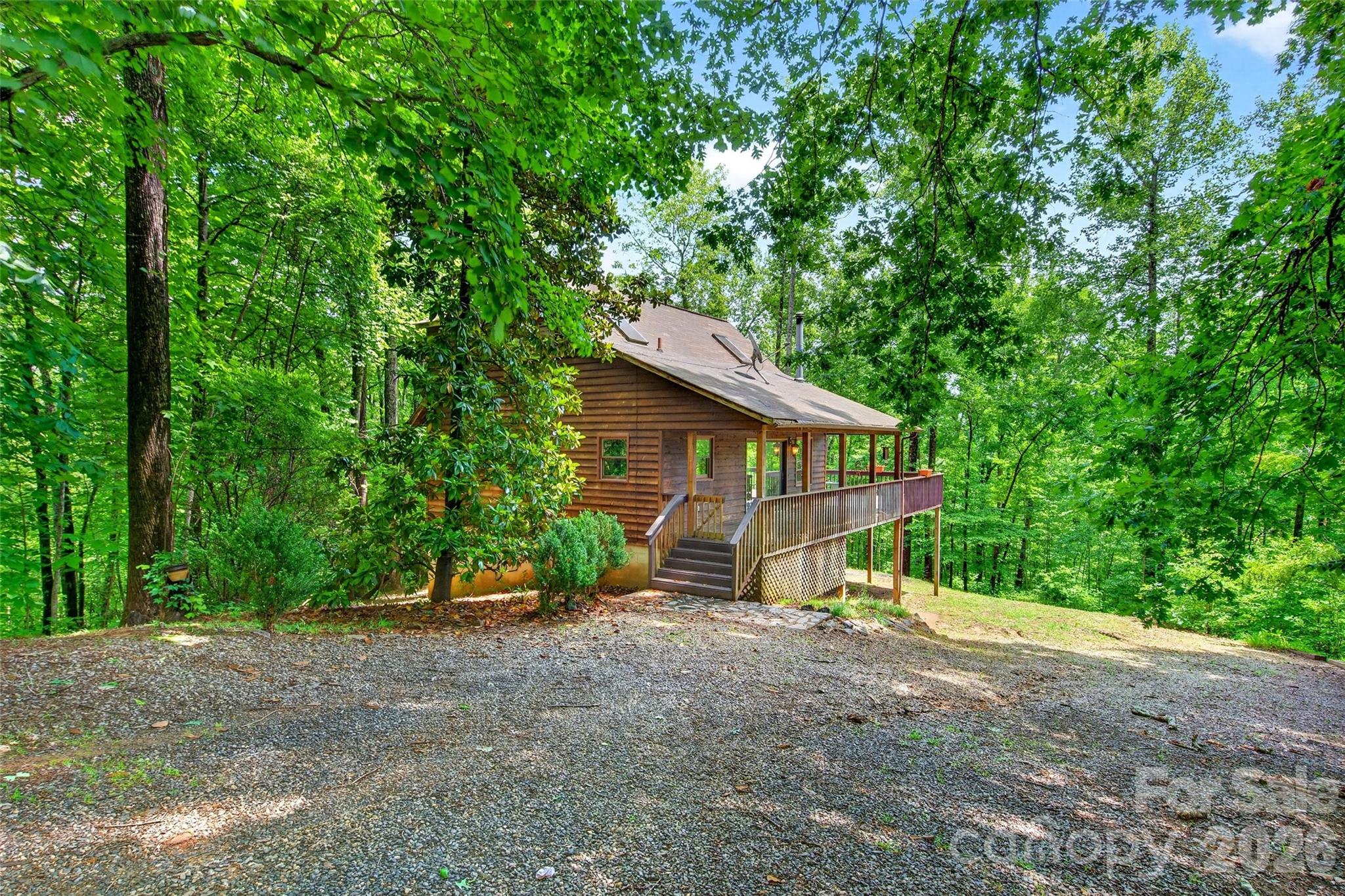 Escape to nature and privacy at 1828 McKenzie Way South in Gateway Mountain. This charming cedar-sided home is nestled among the trees and features a wraparound porch, a level yard, and beautiful mountain views. Enjoy the added privacy of being adjacent to a conservancy while still benefiting from easy paved road access. Located just one mile to Waterfall Park!

The property includes four lots totaling approximately 4 acres, offering additional space and future potential. While the home could benefit from some minor repairs and cosmetic updates, it presents an excellent opportunity to add your own personal touches and build equity in a mountain setting close to all the areas most popular destinations.

Whether you're searching for a primary residence, mountain getaway, or income-producing short-term rental, this property offers tremendous potential. Outdoor enthusiasts will appreciate the endless opportunities for hiking, walking, and exploring within Gateway Mountain, as well as the renowned biking trails and recreation available nearby in Old Fort.

Use this home as your base camp for adventure or simply relax and enjoy your own private mountain retreat. Schedule your showing today and discover the possibilities this unique property has to offer.