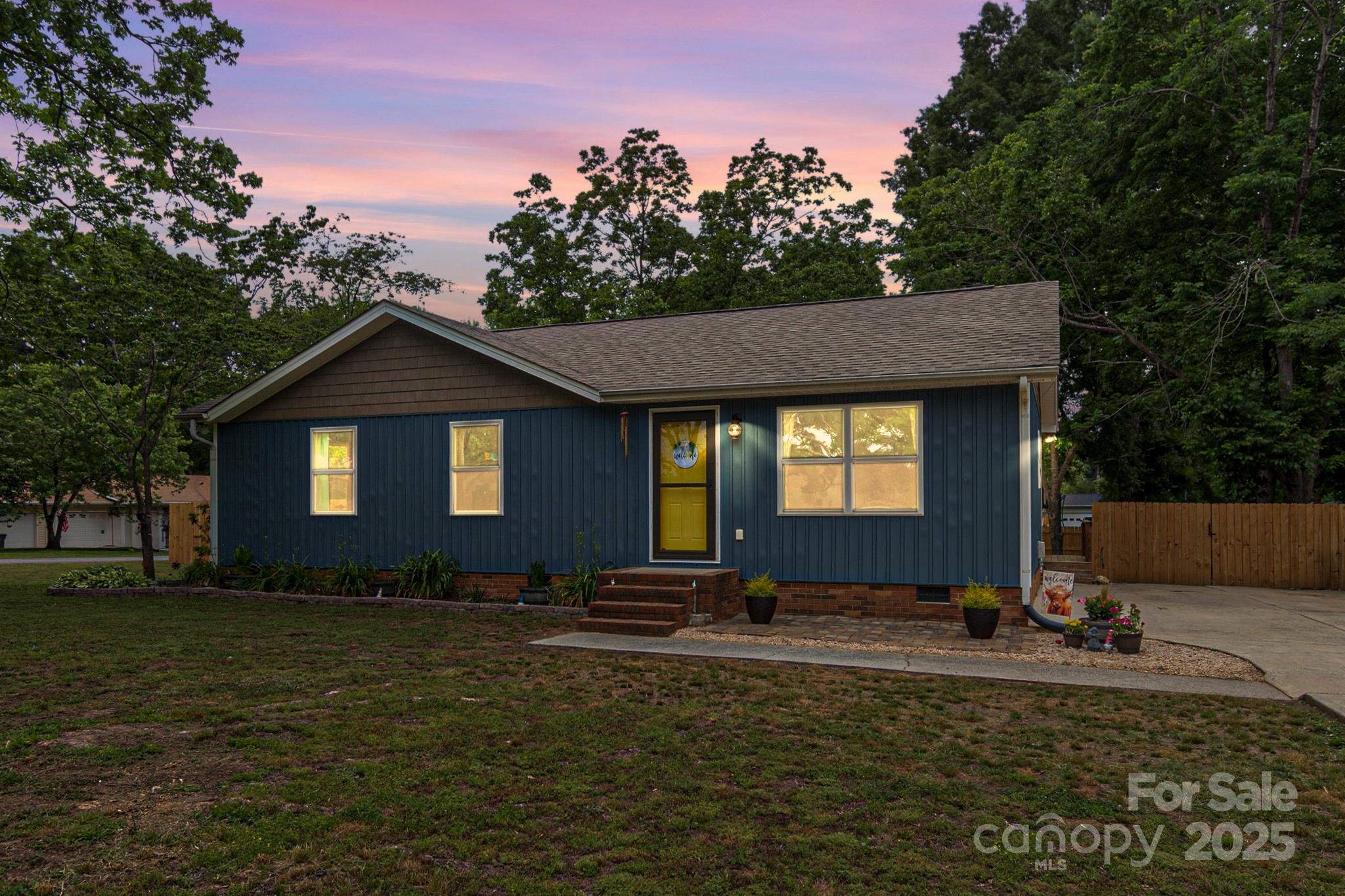 Welcome to this beautifully updated home on a corner lot nestled in an established neighborhood with no HOA! Enjoy relaxing evenings on the screened-in porch, hosting friends around the backyard fire pit, or play freely in the fenced yard. Inside, you'll find tasteful updates throughout, offering comfort and style in every room. The homeowners have poured a lot of love into the home! Siding and Windows (2018), Roof (2016), Privacy Fence (2024), Kitchen Reno (2016), Primary Bath Reno (2021), Panel Box (2016), Porch and Decking (About 2 years old), Paint throughout home (2021, 2024, 2025). Conveniently located near Indian Trail, Monroe, and Sun Valley, you're just minutes from shopping, grocery stores, dining, and entertainment.  It is a perfect blend of charm, location, and modern living—don’t miss this one!