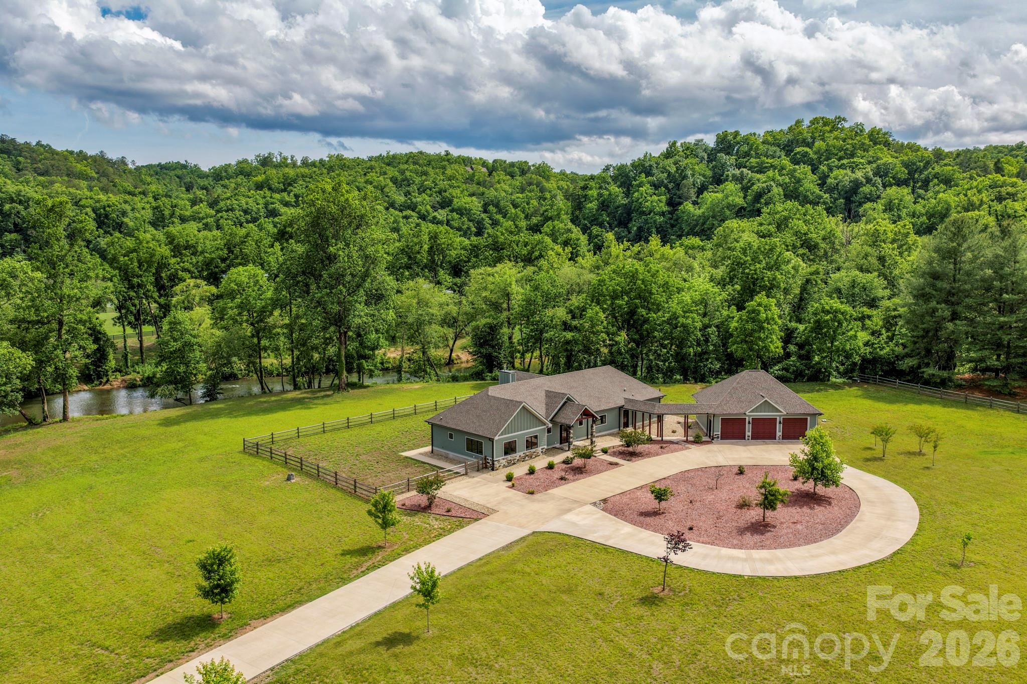 STUNNING RIVERFRONT ESTATE IN LAKE LURE NC. Situated on 8.5 picturesque acres with over 680 feet on the Broad River, this custom built, 3 bedroom, 3 bath new construction dream home is just minutes from Lake Lure & Chimney Rock State Park. Special features include single level living with no steps, a massive 3 car garage, a 10,000 sq ft doggie lot, an ADA suite with ensuite bath and plenty of land for your equestrian dream. Imagine waking up to the soothing sounds of the river, sipping coffee on your porch overlooking the river and enjoying the serenity of your own private oasis. This meticulously crafted home boasts top-of-the-line finishes and thoughtful design, ensuring comfort and style in every corner. Perfect for nature & outdoor enthusiasts and those seeking a peaceful retreat, this property offers endless possibilities. Whether you're kayaking down the river, hiking nearby trails or simply relaxing in your beautifully appointed home, life here is nothing short of extraordinary!