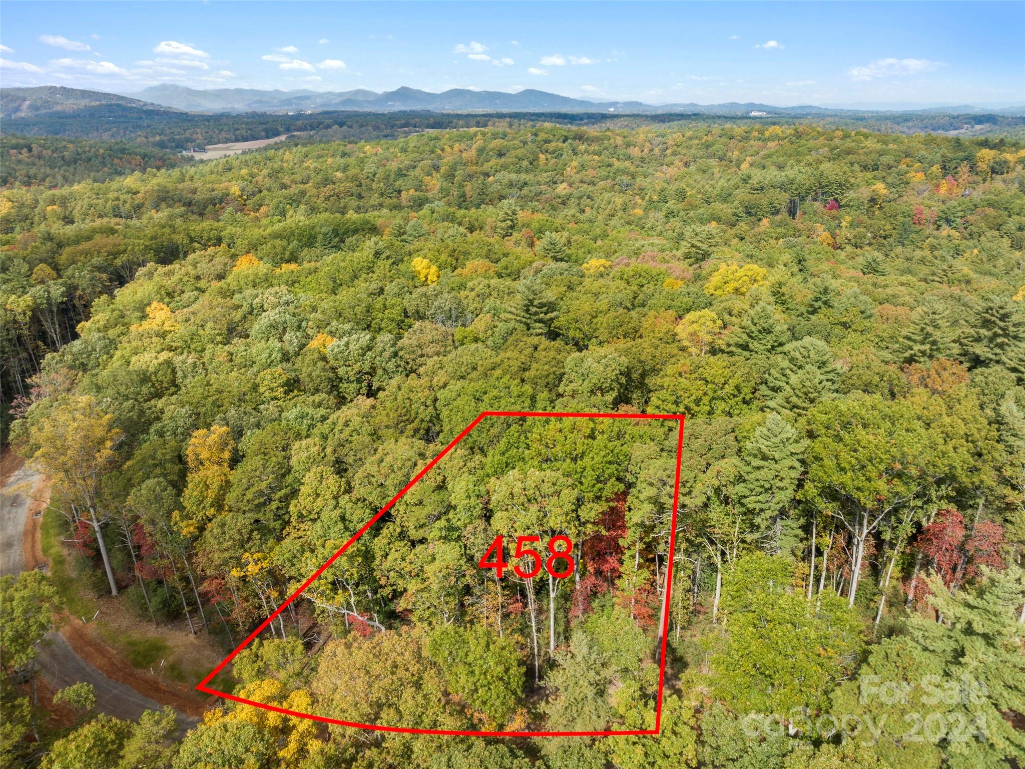 Surrounded by enchanting forests, the Emerald Necklace homesites are a tranquil and private respite within The Ramble.  With an ideal balance of nature, community, and location, these special properties offer quiet luxury near the heart of Asheville. This large estate-sized homesite is gently sloping upwards from the street with southern exposure from the front of the future home and wide street frontage with green space in the rear for privacy.