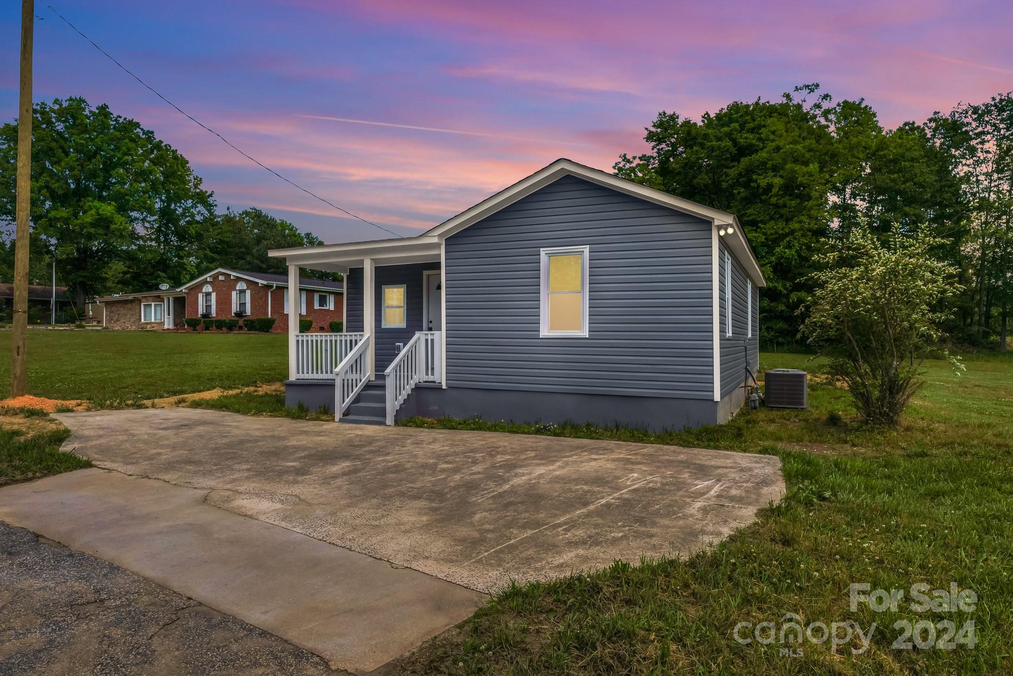 Modern charm meets small-town allure in this fully renovated 2 bed, 2 bath home. Step inside to discover a thoughtfully designed layout, highlighted by a spacious master walk-in closet and stylishly renovated bathrooms. The kitchen is a dream with white cabinetry, stainless appliances, and granite countertops, while the in-unit laundry adds convenience. Relax on the inviting front porch and enjoy the peace of country living. Boasting new HVAC, roof, windows, water heater, and siding, upkeep is effortless. LVP flooring throughout adds durability and style. Don't miss your chance to experience the perfect blend of modern comfort and quaint living. Schedule a showing today!