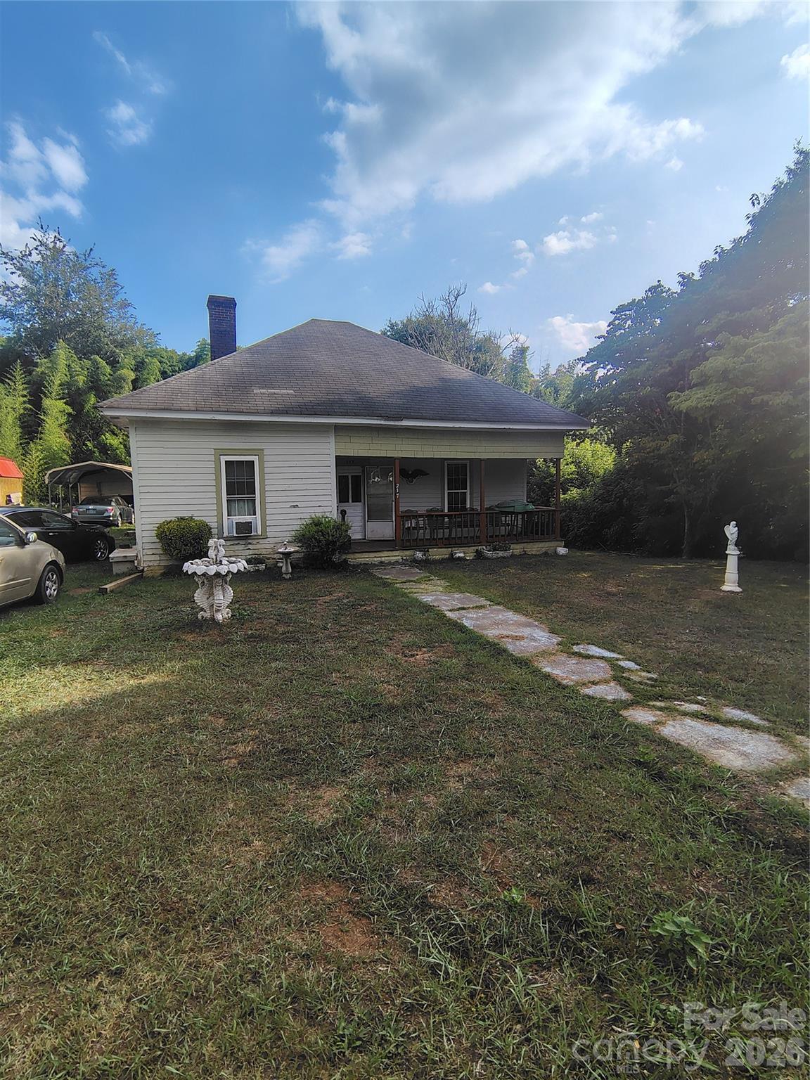 DIAMOND in the rough! 2+ bedroom home with hardwood floors and old-style charm.  This home sits in a unique area of residential homes in Shelby, NC. A short distance to access Hwy 74 Bypass.  Walking distance to a new "Rail Trail" through Shelby which will be a walk and bike track, dog walk and specialty shops with historical markers and info all the way across town.  Home has a large deck, 2 extra rooms off deck now used as a music room and a storage room. Detached Carport. Roof is approximately 5 years old. Hardwood floors. Storage building.