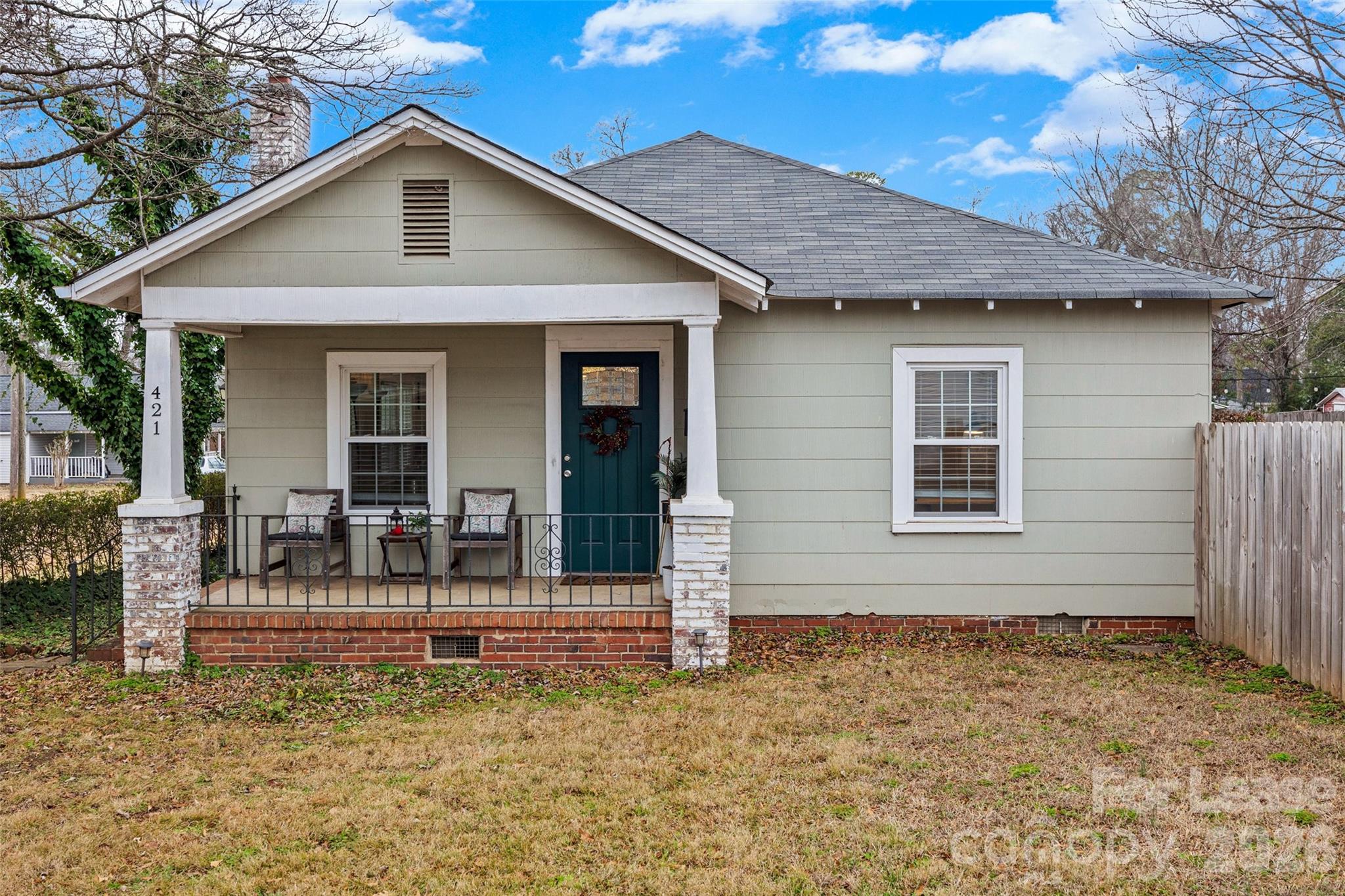 Charming and well-maintained 2 bedroom, 1 bathroom home just minutes from downtown Rock Hill! This thoughtfully designed home features an open-concept living area that seamlessly connects the living room, dining space, and kitchen—perfect for everyday living and entertaining.

Built in 1931 and meticulously cared for, this home blends classic character with comfortable functionality. The second bedroom features an amazing Murphy bed, making it the perfect flexible space to maximize square footage—ideal for a guest room, home office, or multi-purpose room.

Enjoy outdoor living with a fenced yard and patio, great for relaxing or hosting guests. A convenient carport includes a large storage shed, offering plenty of space for tools, bikes, or seasonal items.

Located close to shopping, dining, and all the conveniences of downtown Rock Hill, this home offers charm, versatility, and an unbeatable location. A rare find—schedule your showing today!