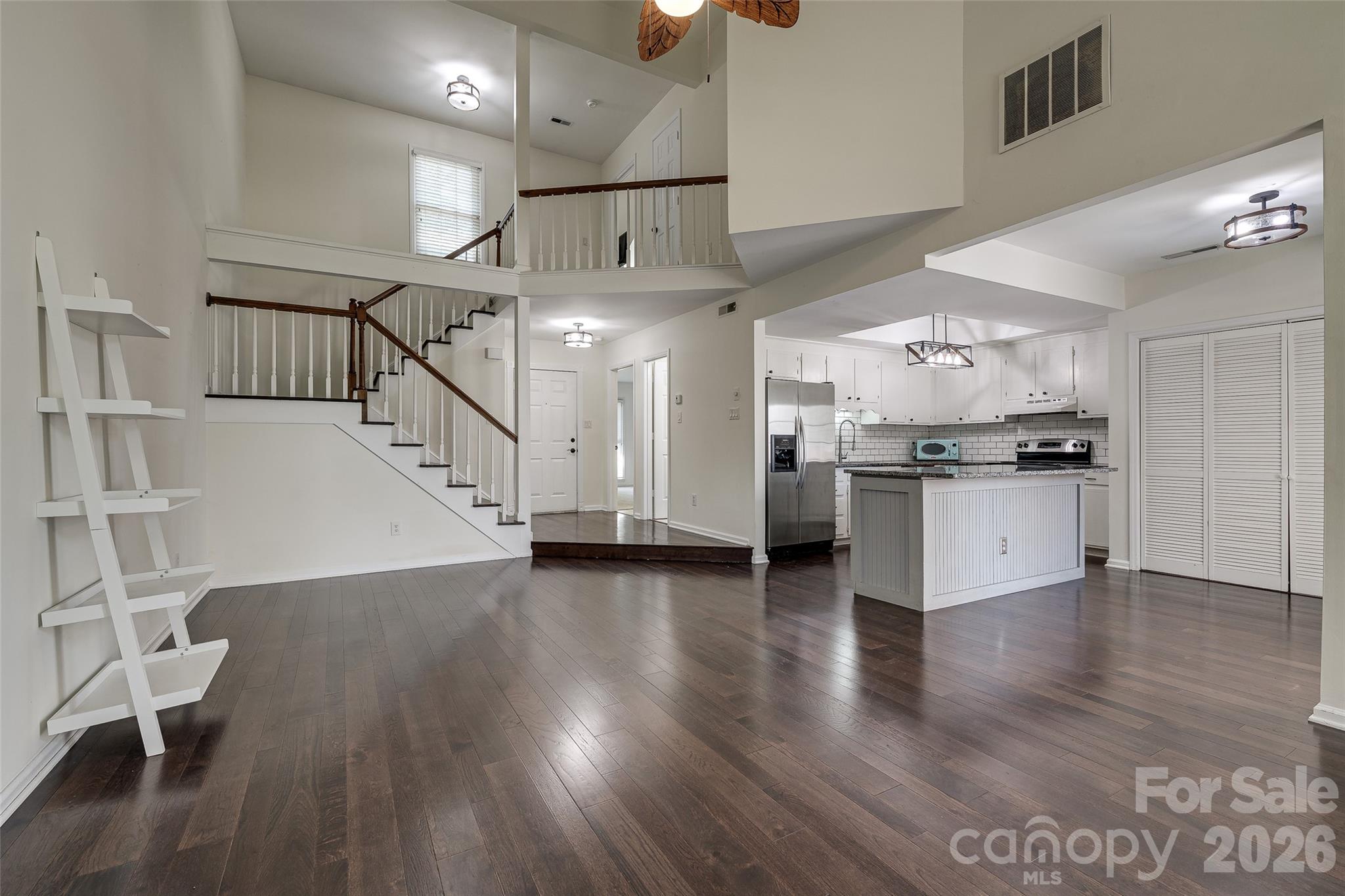 Welcome to Park Walk in the heart of South Charlotte. This updated 2-bedroom, 2-bath condo offers an open and airy floorplan with vaulted ceilings, abundant natural light, and stylish finishes throughout. The spacious great room features hardwood floors and a cozy brick wood-burning fireplace, flowing seamlessly into the updated kitchen complete with granite countertops, large island, and included appliances.

The main level bedroom includes direct access to a full bath, while the upper-level primary suite offers a private retreat with a sitting area, built-in desk, and full bath. A versatile loft space is perfect for a home office, reading nook, or flex area.

Enjoy relaxing evenings on the private enclosed brick patio overlooking green space. Community amenities include a pool and tennis courts, all within a prime location between SouthPark and Ballantyne with convenient access to shopping, dining, parks, and major commuter routes.

Move-in ready and full of charm, this South Charlotte condo offers low-maintenance living in a highly desirable location.