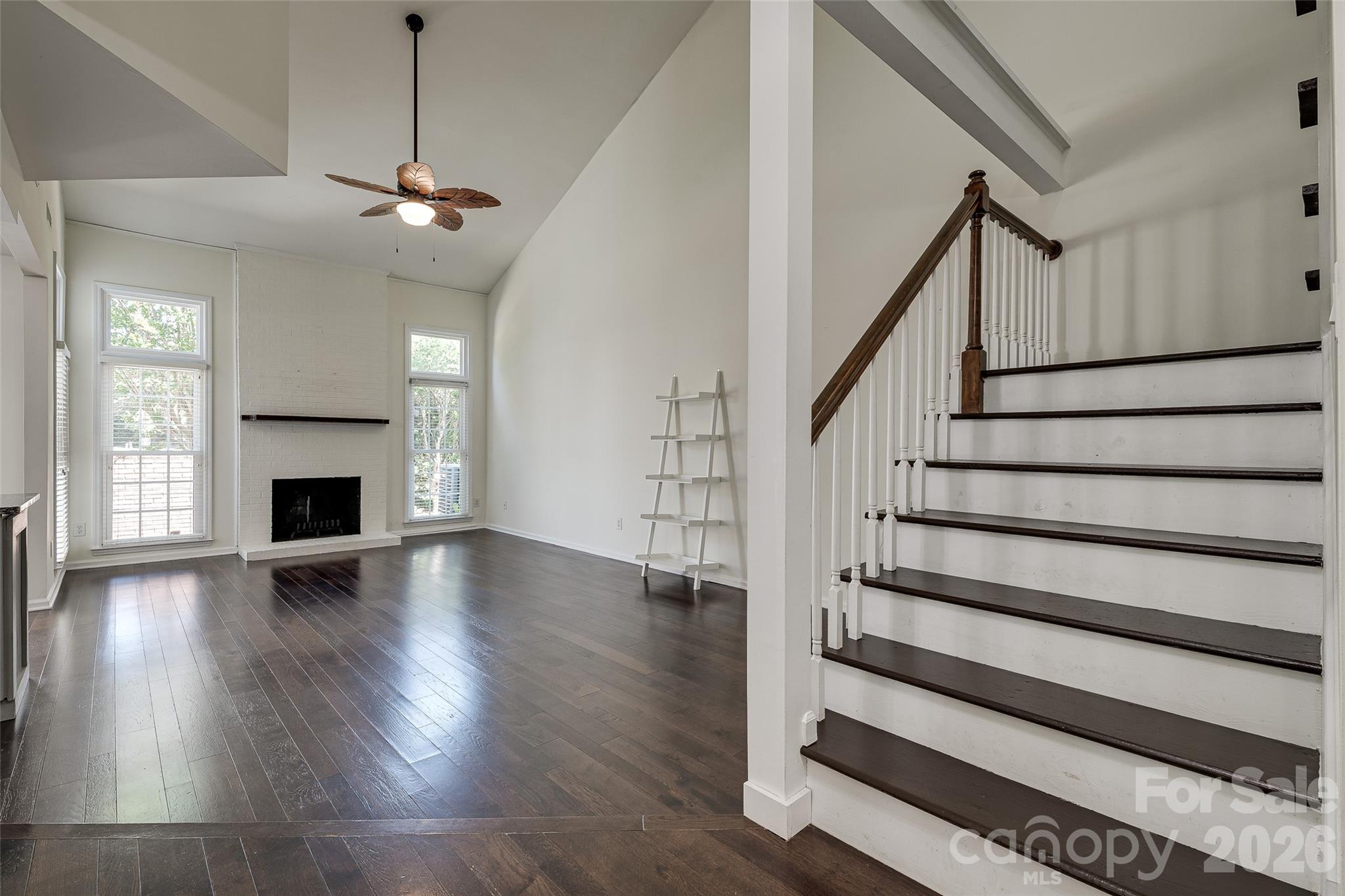 Welcome to Park Walk in the heart of South Charlotte. This updated 2-bedroom, 2-bath condo offers an open and airy floorplan with vaulted ceilings, abundant natural light, and stylish finishes throughout. The spacious great room features hardwood floors and a cozy brick wood-burning fireplace, flowing seamlessly into the updated kitchen complete with granite countertops, large island, and included appliances.

The main level bedroom includes direct access to a full bath, while the upper-level primary suite offers a private retreat with a sitting area, built-in desk, and full bath. A versatile loft space is perfect for a home office, reading nook, or flex area.

Enjoy relaxing evenings on the private enclosed brick patio overlooking green space. Community amenities include a pool and tennis courts, all within a prime location between SouthPark and Ballantyne with convenient access to shopping, dining, parks, and major commuter routes.

Move-in ready and full of charm, this South Charlotte condo offers low-maintenance living in a highly desirable location.
