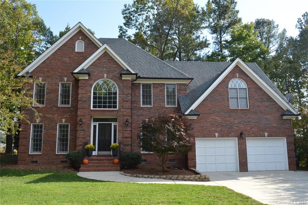 Stately Brick custom home on Golf course in recreational community on Lake Wylie, SC. Renown Ft. Mill Schools. Dramatic 2-story entry w beveled leaded glass.  Formal Living, Dining, Library-Den w custom Bookcases. Custom wood trim. Master Suite w tray ceiling, Bath w Jacuzzi, frameless shower, 2 sinks, vaulted ceiling. Eat-in Kitchen, Island, Corian counters, hardwoods, pantry, Bay window. Bonus Media Room w Surround-sound. 2 Staircases, Central Vac,Security system.Updated:Roof,Bath,Dual HVACs,