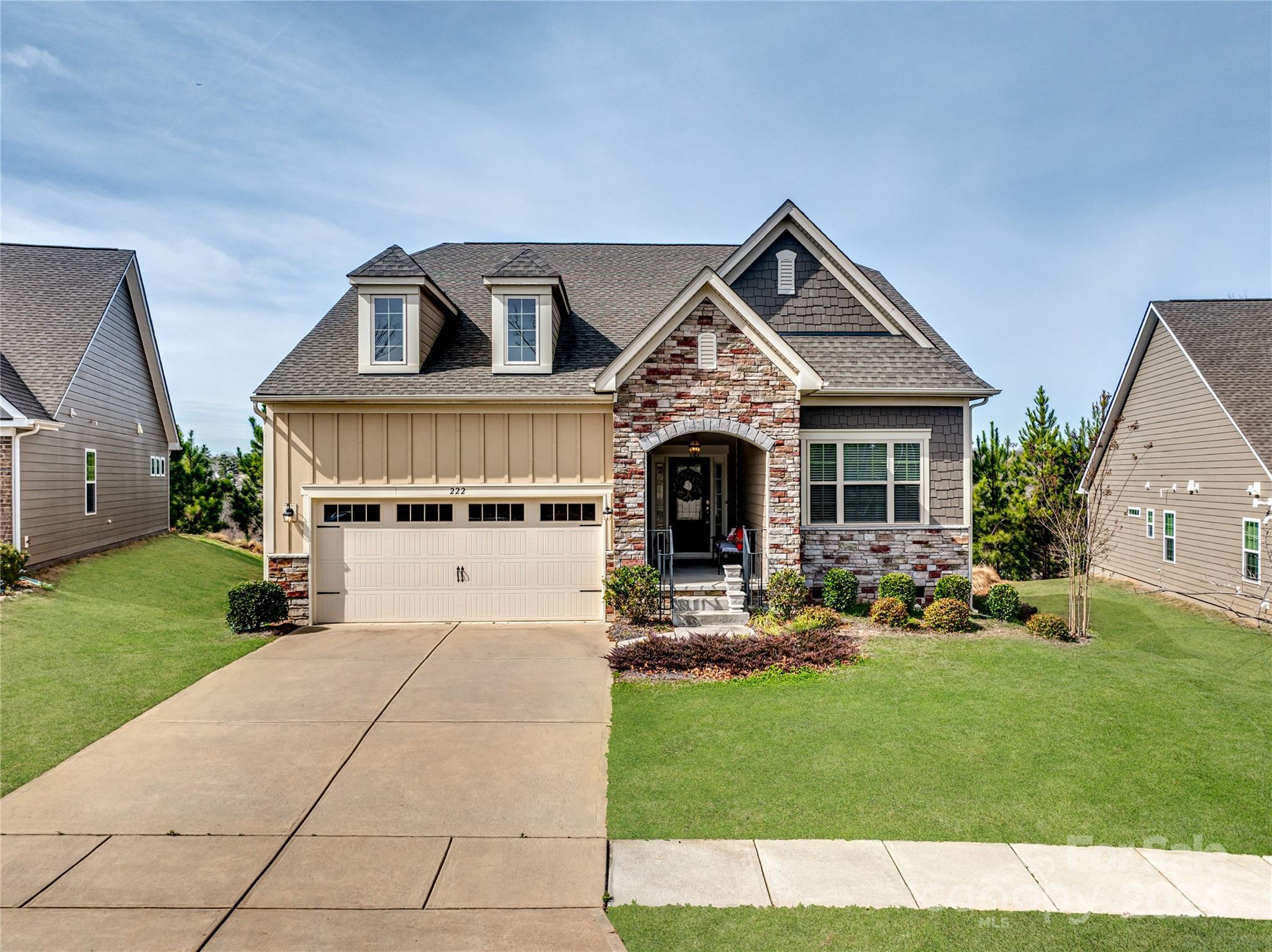 This lovely "One Owner" 2 BDRM, 2 BATH, Ranch home is straight out of a magazine! Nestled on a spacious .26 acre lot in the Summerhouse Paddlers Cove Community at Lake Wylie, features include an open floor plan with wood flooring throughout, full-sized Dining Room/Office w/ French Doors and a gas-log fireplace in the Family Room. The Kitchen has a massive granite island w/ Breakfast Bar, stainless appliances + Frigidaire refrigerator, gas range, walk-in pantry and dining area w/ wainscoting and chair rail. The Primary Suite is enhanced by an elegant en suite bath that features dual granite sinks, garden tub, tiled glass shower, separate water closet and walk-in closet room. Dining Room can be converted to a 3RD BDRM by adding a closet and door. The Laundry has tiled floor and includes Frigidaire Washer & Dryer. Enjoy seasonal evenings on the screened Sun Porch and Patio with built-in gas grill. Finished 2-car Garage with Drop Zone, shelving and storage. Tankless water heater and More!