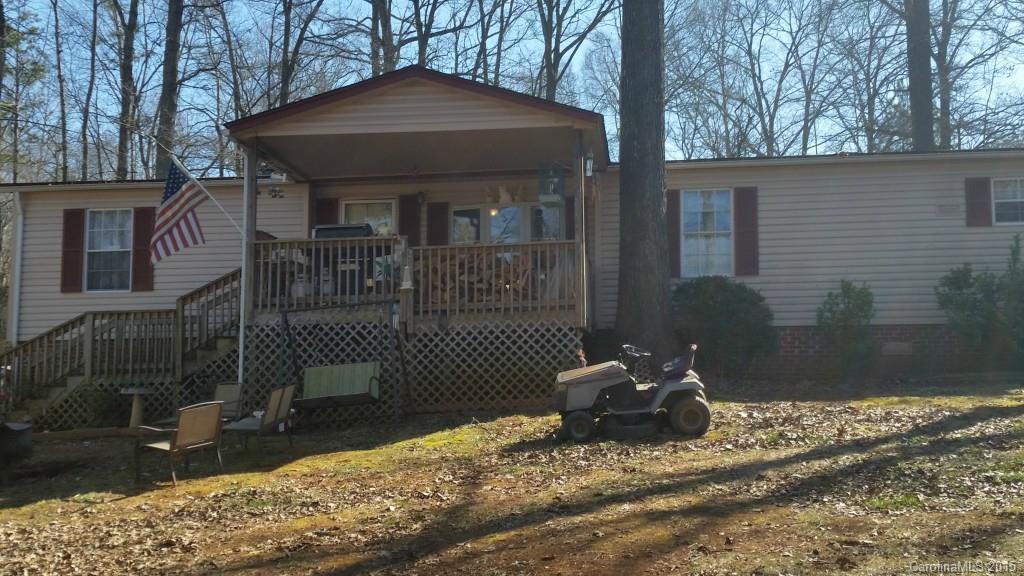 Spacious Double wide features large Greatroom with Fireplace, Dining, eat in kitchen with all appliances, laundry/mud room, 3 bedrooms 2 full baths. Garden tub and shower in master, small deck at mudroom, large covered deck at front. Carport and storage. Huge 2.22 acre lot!!