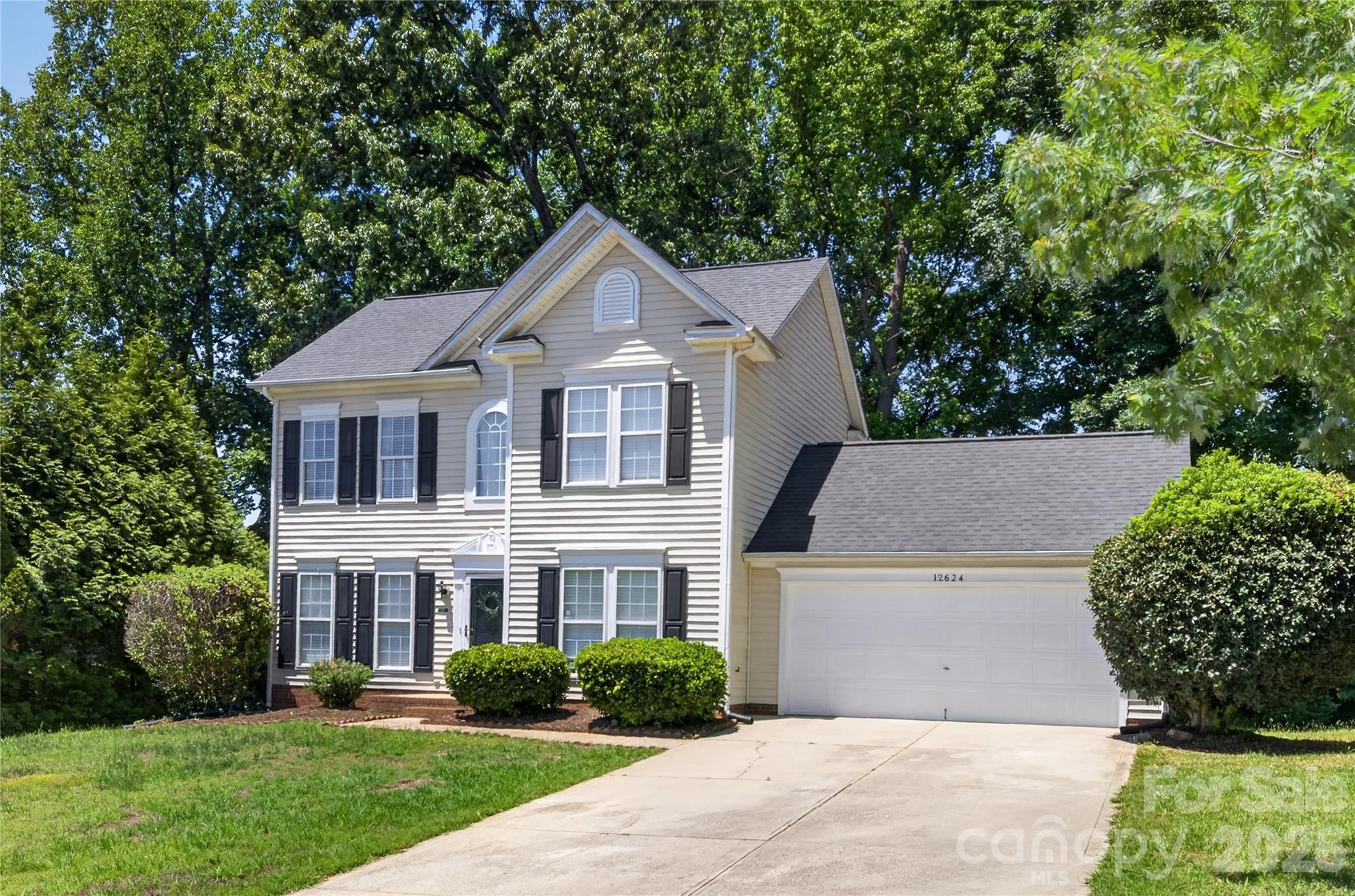 Welcome to 12624 Cardinal Woods Dr, a beautiful 3-bed, 2.5-bath home tucked away in a tranquil Pineville neighborhood just minutes from everything the Ballantyne area has to offer. With 1,615 square feet of comfortable living space, a 2-car garage, and mature trees providing a peaceful backyard setting, this home combines a functional layout, desirable features, and an unbeatable location convenient to shopping, dining, entertainment, and major commuting routes.

The main level features durable LVP flooring throughout the primary living areas, along with a dedicated dining room, convenient half bath, and a bright breakfast area just off the kitchen. The kitchen is equipped with stainless steel appliances, granite countertops, tile flooring, pantry, and a center island that provides additional prep space and seating, making it ideal for both everyday living and entertaining. The living room offers a cozy place to relax with a gas fireplace that adds warmth and character.

Upstairs, the spacious primary suite features tray ceilings, a large walk-in closet, and an en-suite bath complete with a garden tub and separate shower. Secondary bathrooms feature tile flooring and the upstairs bedrooms offer comfortable carpeting. The laundry room is conveniently located upstairs for everyday use.

Enjoy the peaceful setting while being just minutes from Ballantyne, Downtown Pineville, shopping centers, restaurants, grocery stores, and entertainment. The location also provides quick access to major highways, making commuting throughout the Charlotte area simple and convenient.

This home offers a great opportunity to enjoy comfort, convenience, and a highly desirable location all in one. Schedule your showing today!