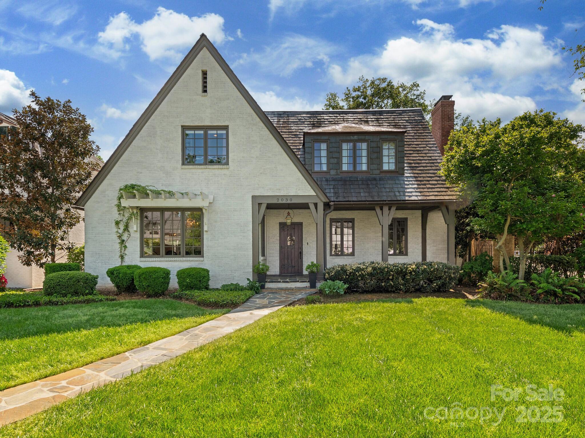 One of a kind home that has all the charm/amenities a buyer desires located in the heart of Myers Park. Once you enter into this house you are captivated by the beautiful millwork -coffered ceilings, wainscoting, custom cabinetry, hardwood floors & wide entry ways. Spacious Living Room & Dining Room w/built ins & multiple windows that provide ample sunlight. The Family Room opens to the Kitchen both overlooking the covered porch & backyard.  The staircase splits when you get to the second floor which provides an open hallway.  The Primary bedroom has a large walk in closet, spacious bedroom w/a beautiful view of the pool from the Balcony. You can hear the water fountain from the Primary ! Secondary bedrooms are a distance away that provides privacy for the Primary. Lower level has a playroom, small bar area & a large wine cellar.  The covered terrace leads you to a private oasis. Water fountains, entertaining area encompass a circular pool! G. suite above gar.&  turf byard.