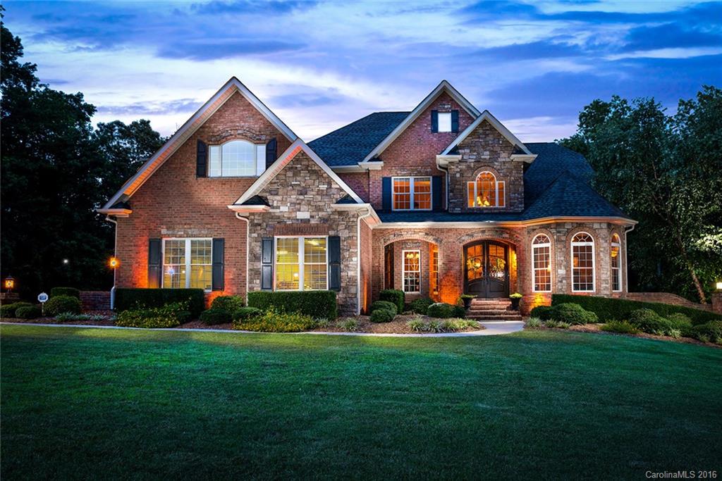 Gorgeous Custom Built home Nestled on Private Wooded Lot. Home features Architectural appeal and detail thought out with heavy moldings, and transitional  / Multi level trey ceilings. Property Boast a Gourmet Kitchen with a huge center Island, granite, SS App, and breakfast nook. Two Story Great Room W / FP. Spacious Master on Main with Spa themed Bath. Lower level offers, Rec Room, Media, Den W/FP, and 2nd Kitchen. Outdoor features include fire pit, Irrigation, patio, deck, and screen porch.