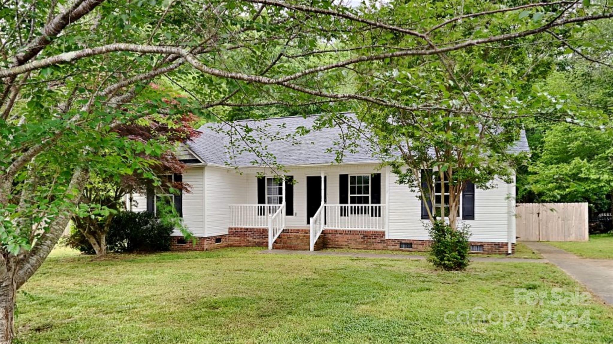 Welcome Home! This charming ranch home is situated on a spacious lot in York with no HOA. Inside the front door, you are greeted by a spacious living area which adjoins to the dining room, which features sliding doors out to the large back deck and fenced in backyard, and the recently updated kitchen. The kitchen features granite countertops and stainless appliances (range, microwave, and dishwasher to convey). To one side of the living room, a hallway connects two guest bedrooms and a full guest bath. On the opposite side, the primary bedroom awaits. This spacious retreat features two closets and a spacious, private bathroom of its own. Don't miss this opportunity, stop by today!