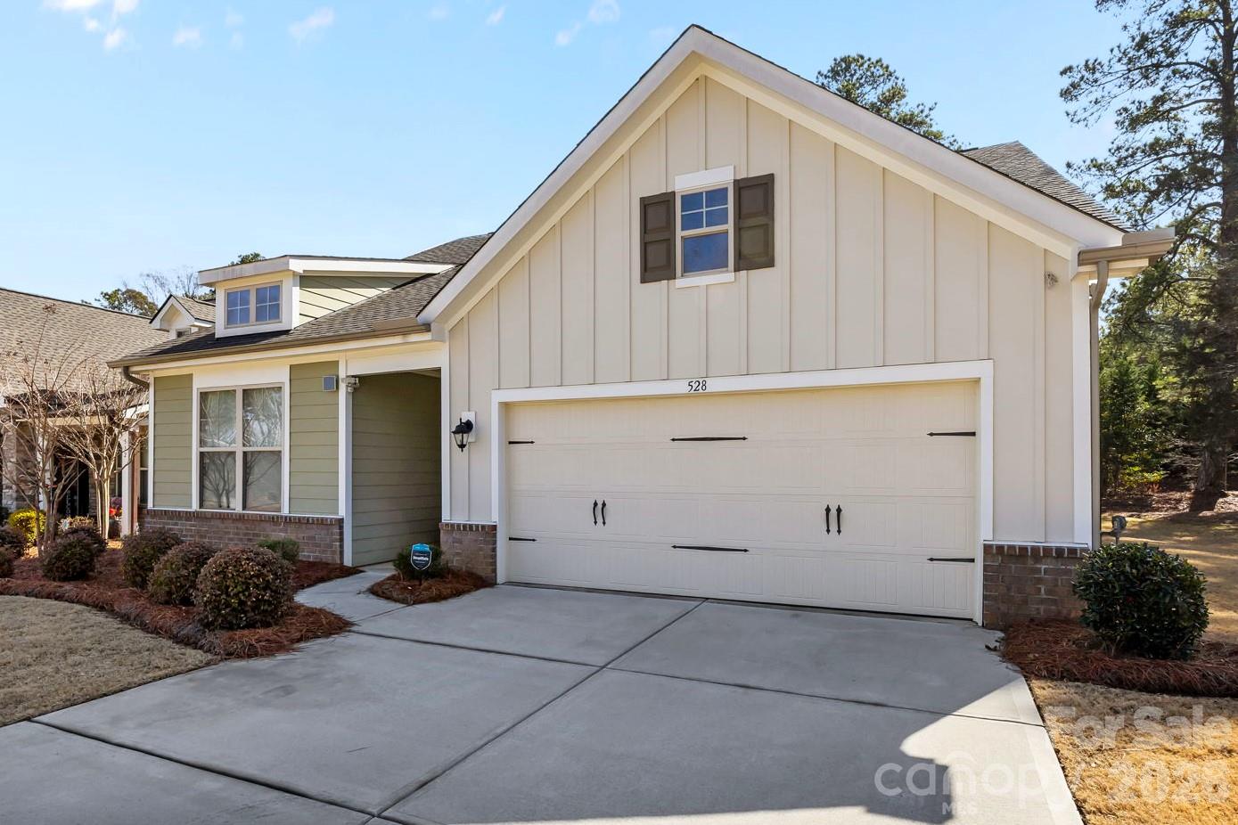 Welcome to this stunning 2021-built gem, perfectly situated on a prime corner lot in the desirable Rhyne Estates neighborhood. Meticulously maintained and freshly painted, this home offers a seamless blend of modern style and effortless functionality. The heart of the home is an expansive open-concept living area and a gourmet kitchen featuring 42" cabinetry, a large kitchen island, and a step-in pantry. The main-level primary suite is a true sanctuary with a walk-in closet and a spacious bathroom featuring a dual vanity and a zero-entry shower. Two additional main-floor bedrooms provide great flexibility for guests or an office. Upstairs, you'll find a private retreat with a spacious living room, a fourth bedroom, and a third full bath. Step outside to enjoy the screened-in porch and flat, fully fenced backyard, offering the perfect balance of privacy and room to play. The HOA includes year round landscaping for low maintenance living. This move-in-ready beauty is truly a must-see!