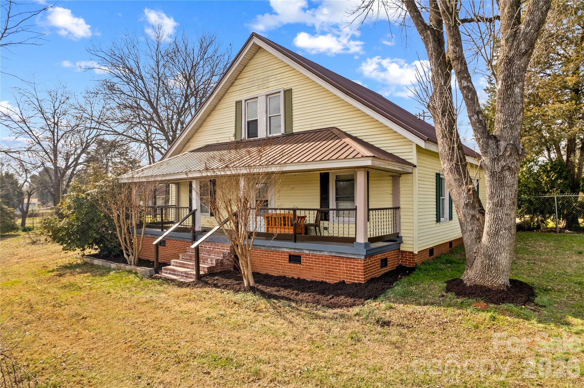 BRING OFFER - MOTIVATED SELLER!  With over 2,450 square feet of living space, this adorable farmhouse offers plenty of room for everyone! The main level features a spacious living room, an open kitchen and dining area, two bedrooms, and two full bathrooms. The kitchen includes ample cabinetry, an island, and all appliances convey. Spacious primary suite with walk-in tub and large walk-in closet.  Upstairs, you’ll find an additional bedroom, full bathroom, and versatile flex space perfect for a home office, playroom, or additional living area. This home blends timeless character with thoughtful updates, including a mini-split for upstairs, metal roof and new water heater. Conveniently located near downtown China Grove amenities with easy access to I-85. HOME WARRANTY up to $500 offered with acceptable offer!
