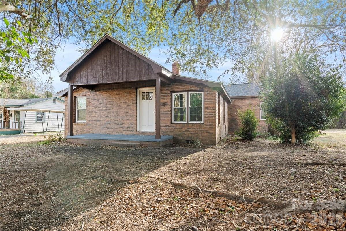 Beautifully renovated brick home ideally located near downtown! This move-in-ready property features numerous updates, including a brand-new roof, energy-efficientwindows, new HVAC system, stylish flooring, and fresh interior paint throughout. Enjoy relaxing mornings on the charming covered front porch and entertain with ease on the spacious back deck. A perfect blend of classic character and modern upgrades—don’t miss this opportunity!