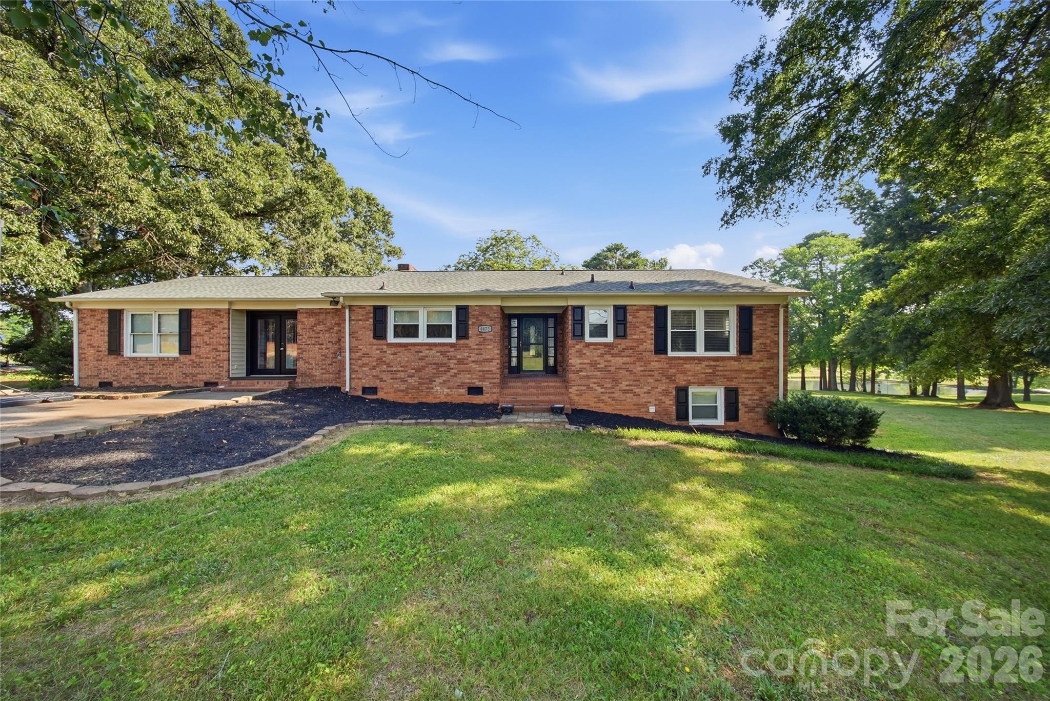 Welcome home to this well-maintained 4-bedroom, 3-bath residence offering 2,400 sq ft of comfortable living space in one of Maiden's most convenient locations. Built in 1976, this solid family home sits on a lovely lot steps away from daily conveniences like Food Lion and just minutes from downtown Maiden's charming shops and restaurants.
Inside, you'll find plenty of room for growing families or empty nesters who love having space for guests and hobbies. The open flow works well for everyday living and entertaining, while the extra square footage means comfort and breathing room throughout. Multiple bathrooms make mornings easier for busy households.
The seller has invested thoughtfully in this home's systems and foundation. The crawl space is encapsulated with a sump pump and dehumidifier installed—a smart upgrade that protects against moisture and helps keep energy bills in check. A new roof went on in 2020, and one of the HVAC units was replaced that same year, so you're moving in with recent work behind you.
What really sets this property apart is its location—you get that peaceful, tree-lined neighborhood feel without being far from anything you need. Downtown Maiden is minutes away, and with the recent growth and investment in the area, your home is in a community with real momentum and strong bones.
This is the kind of house where families put down roots. Come see it today.

Sq. Ft is Approximate Measurements for upstairs and downstairs coming soon