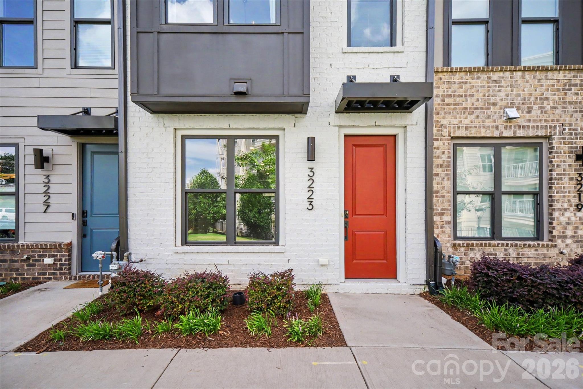 This 2023-built luxury townhome lives like new construction and sits in one of Charlotte's most sought-after pockets: South End. Step outside and you're minutes from the neighborhood's best restaurants, breweries, gyms, shops, and nightlife — plus easy access to the Light Rail for a quick trip Uptown.

Inside, the layout is made for both everyday living and entertaining. The ground floor welcomes you with a tandem two-car garage and a foyer that leads up to the heart of the home. On the main level, an open-concept design blends the gathering room, dining area, and gourmet kitchen — with a private outdoor deck extending your living space outside. Upstairs, two spacious bedrooms each enjoy their own en-suite bath, and the top floor offers a bonus bedroom, full bath, and a beautiful home office — ideal for remote work or guests.

Add in rooftop views and a location that puts South End's energy right at your doorstep, and you've got a home that checks every box. Don't miss this one — schedule your showing today!