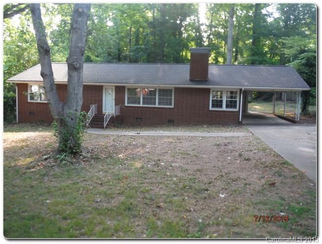 Charming Brick Ranch in Gardner Park!! Home has tons of curb appeal with 1 car attached carport, large patio overlooking the tree lined backyard with a Shed. Period details abound on the interior with classic paneling, wood floors, retro kitchen and baths, sunroom and large fireplace in den.